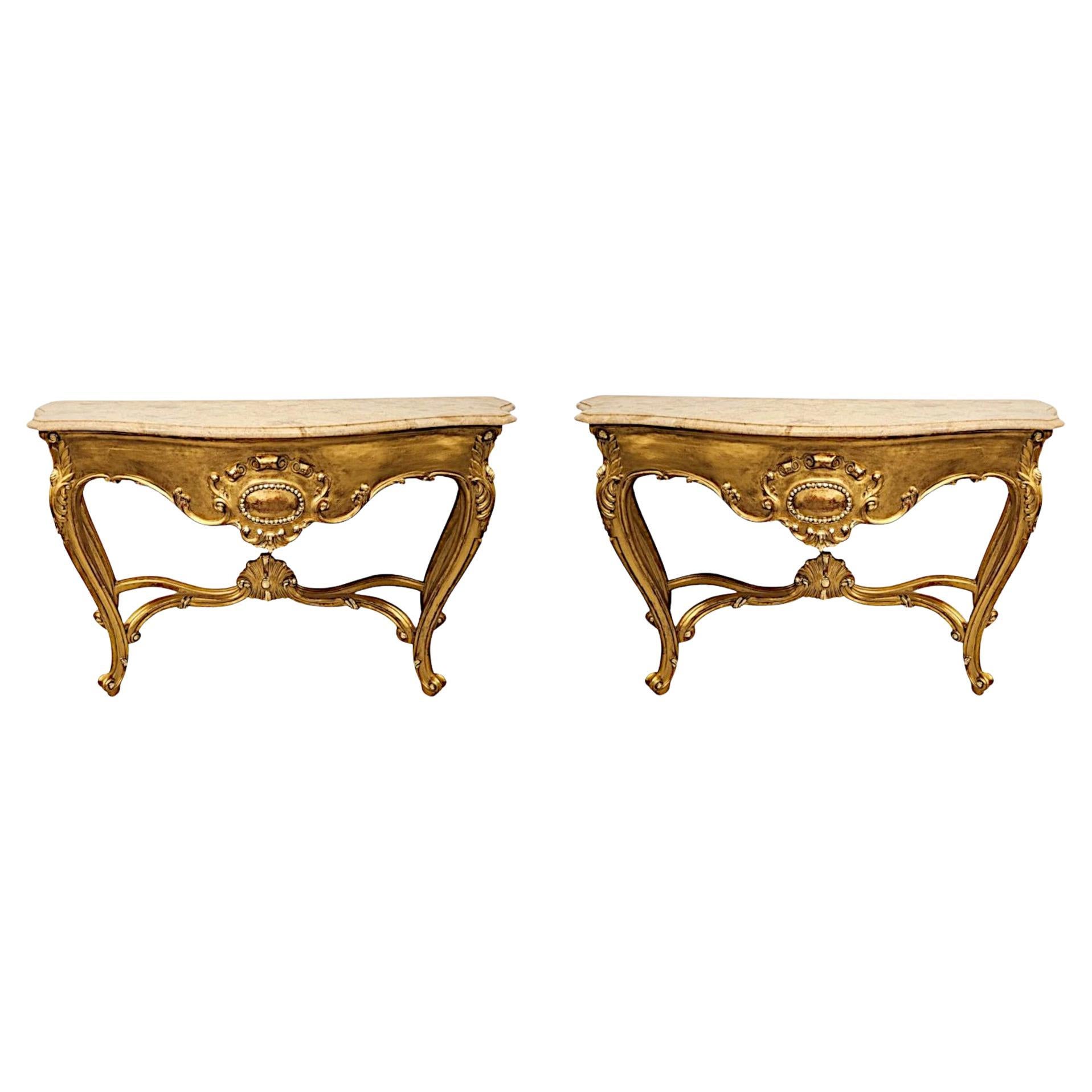 A Very Fine Pair of Early 20th Century Marble Top Giltwood Console Tables  For Sale