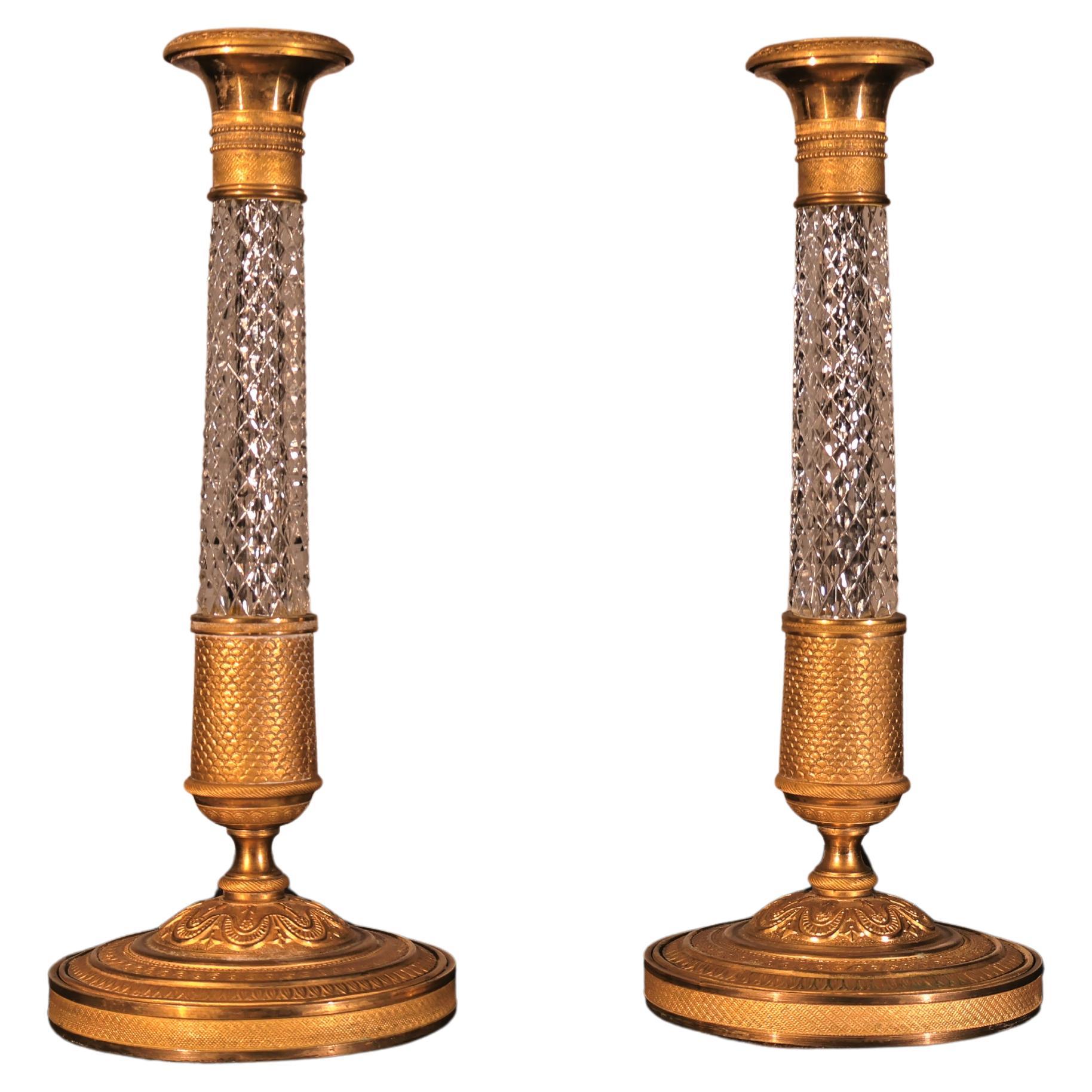 A Very Fine Pair of Gilt Bronze 
Crystal Candlesticks For Sale