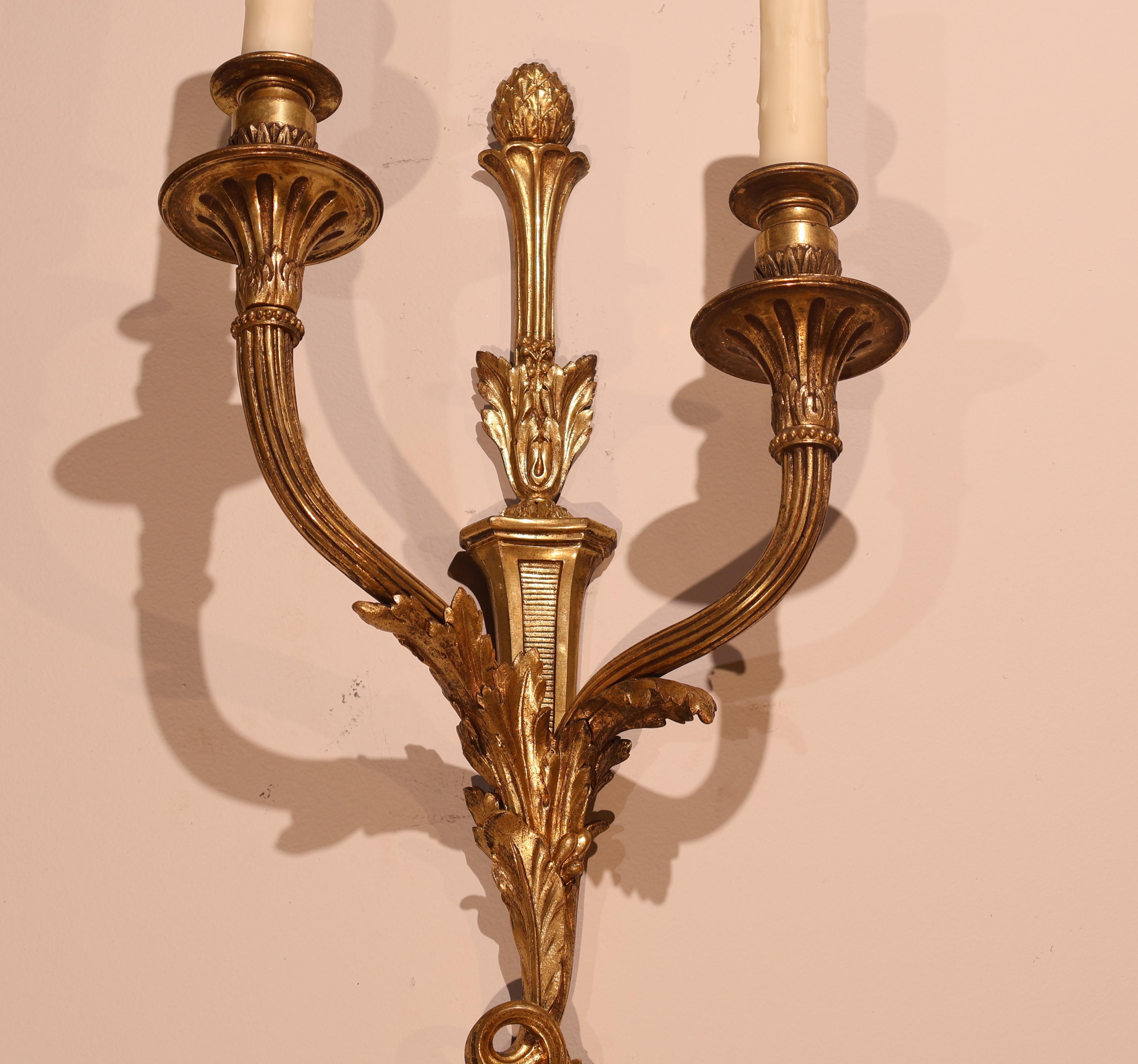 A Very Fine Pair of Gilt Bronze Wall Sconces in the Louis XVI taste. Original mat & burnish gold. Good Detail. France, circa 1910.
Dimensions: Height 24  Width  11