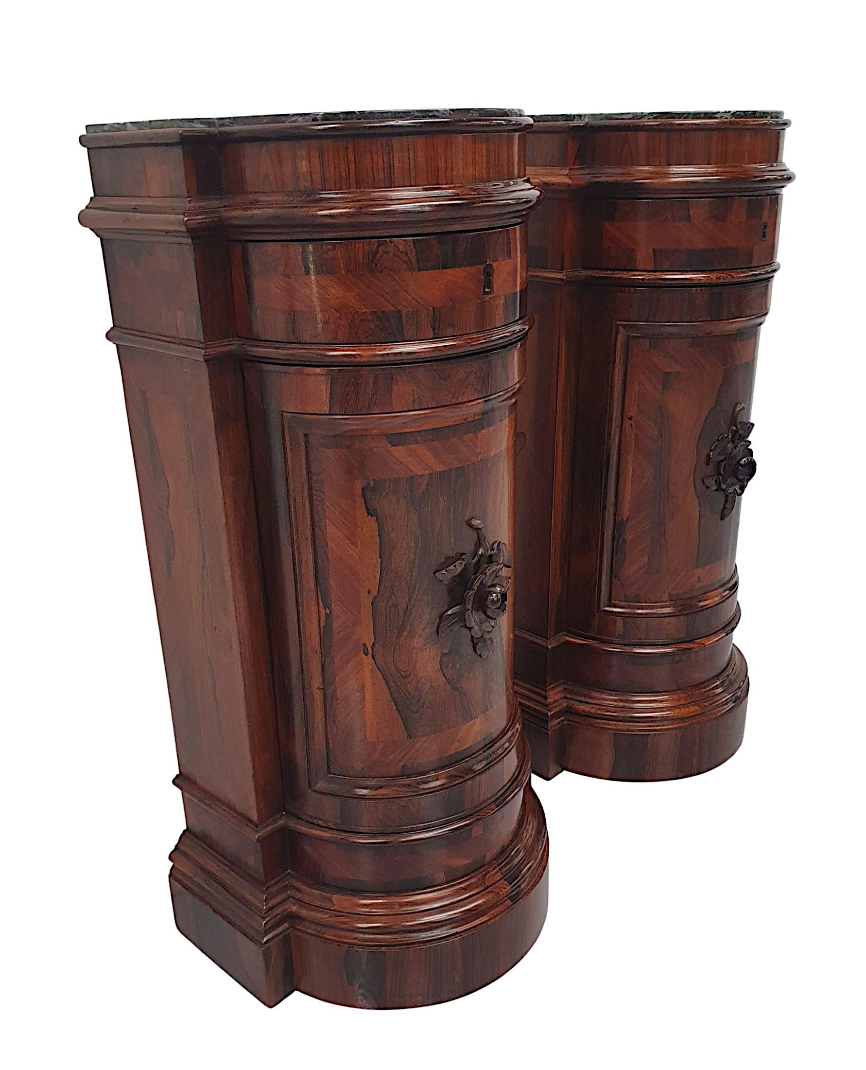 A very fine pair of late 19th Century richly patinated, fruitwood marble top dome fronted plinths or side cabinets. Fabulously hand carved and crossbanded throughout, the gorgeous moulded Marquina Black marble top is raised over a simple, panelled
