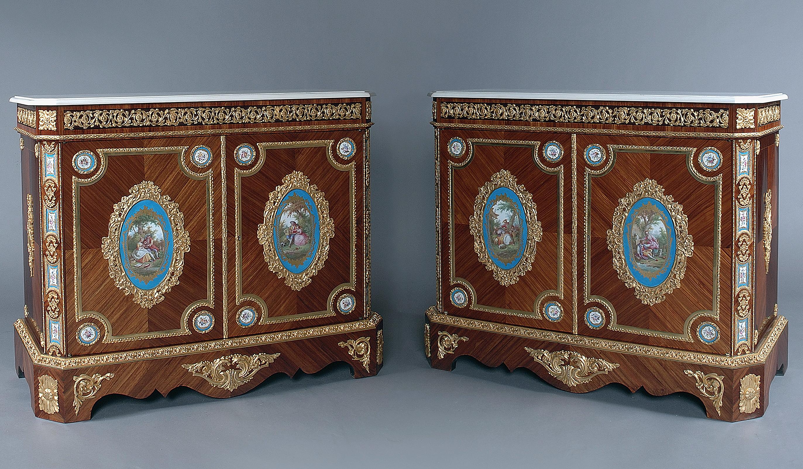 A very fine pair of gilt bronze mounted side cabinets with Sèvres-style porcelain panels.

French, circa 1860.

A very fine pair of gilt bronze mounted side cabinets with Sèvres-style porcelain plaques. Each cabinet with a shaped white marble