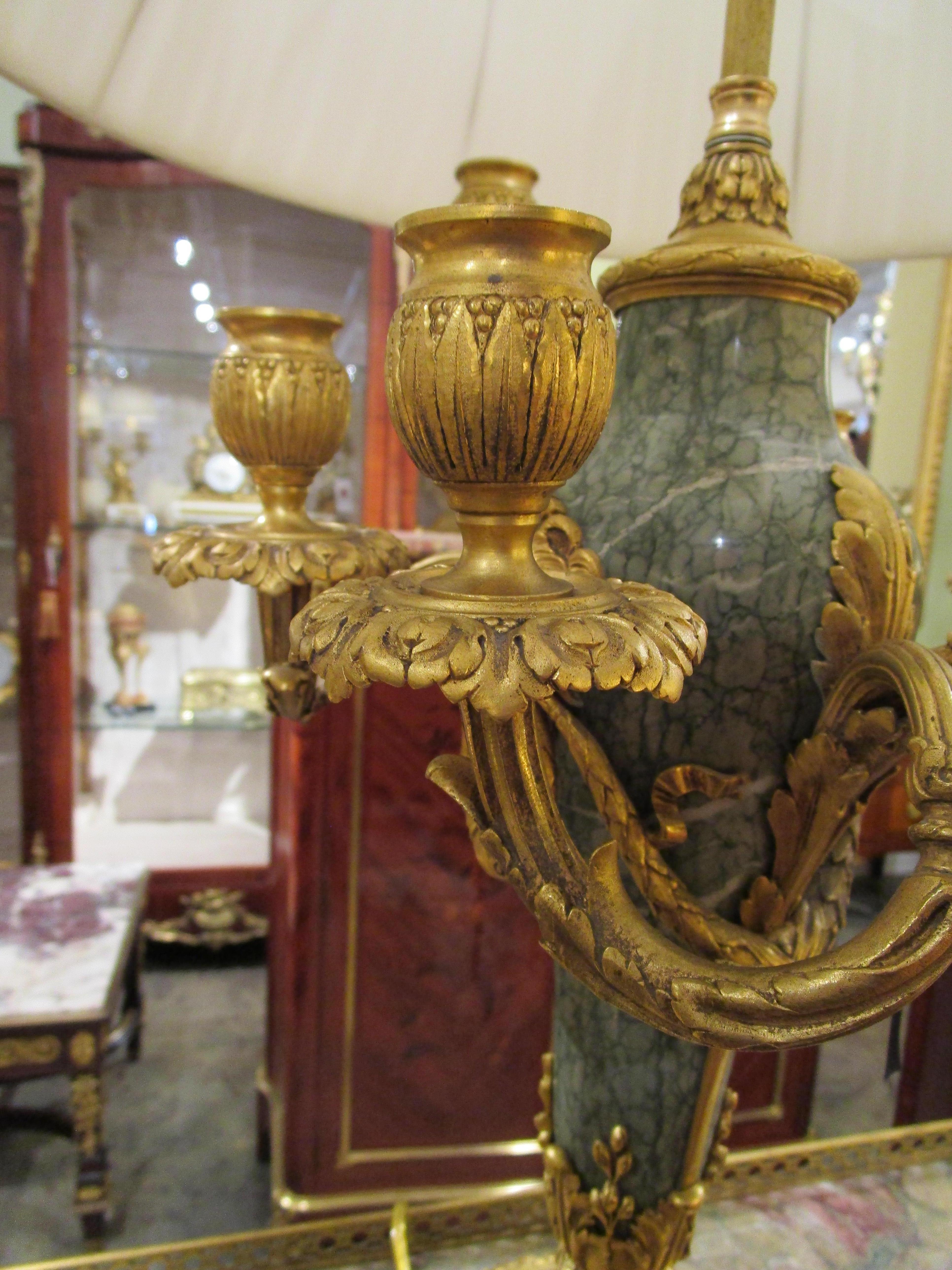 Marble A  pair of signed 19th c  Louis XVI marble and gilt bronze lamps by Thiebault For Sale