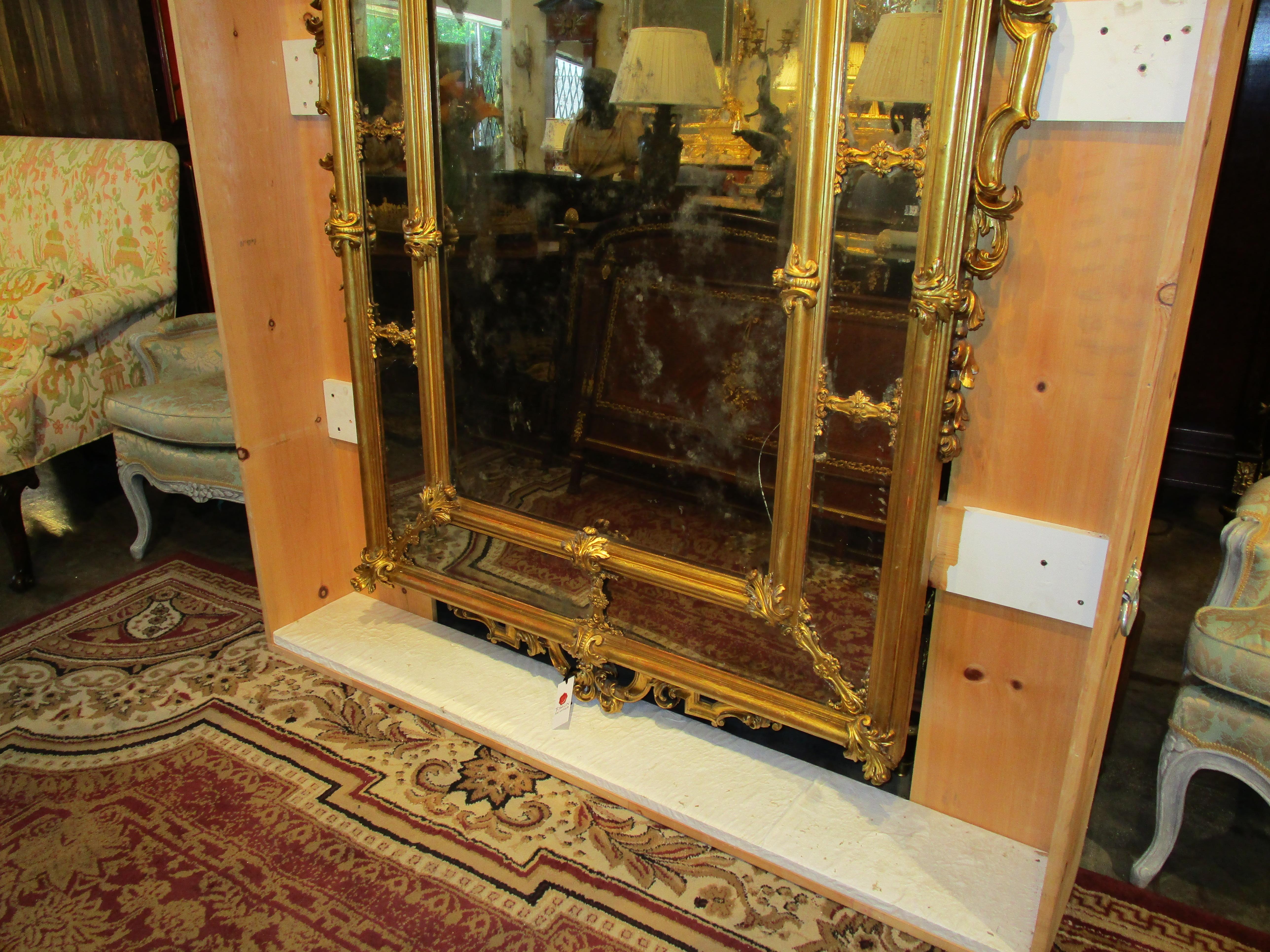 A fine palatial French Louis XV period gilt carved mirror. Beautiful details with  vine and floral carving. 