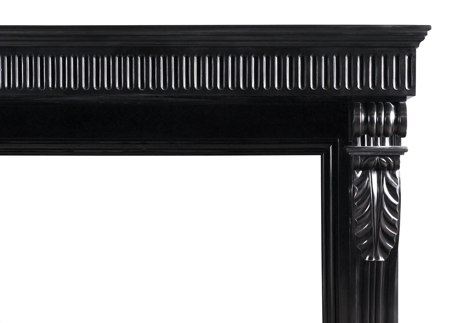 A very fine quality period Louis Philippe fireplace in Belgian Black marble. The shaped jambs carved lion's feet to base, surmounted by carved scrolls with acanthus leaves to front and scrolls above. The frieze with fluting throughout, with moulded