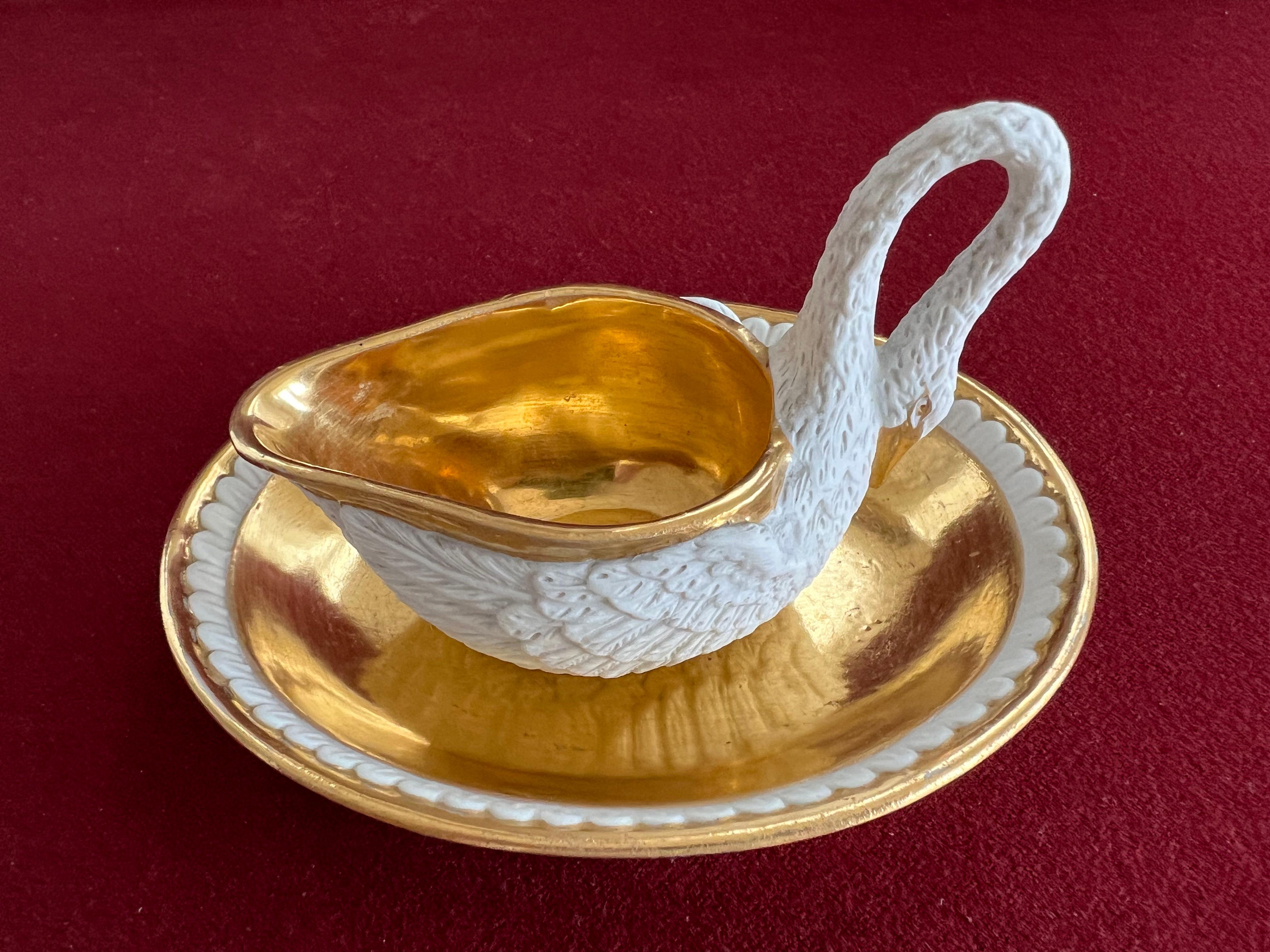 A very fine Sevres cup and saucer modelled as a naturalistic swan in biscuit porcelain and finely gilded. In excellent condition only showing very minor surface scratches on gilding inside the cup. No damage or restoration. Marked in Red Stencil 