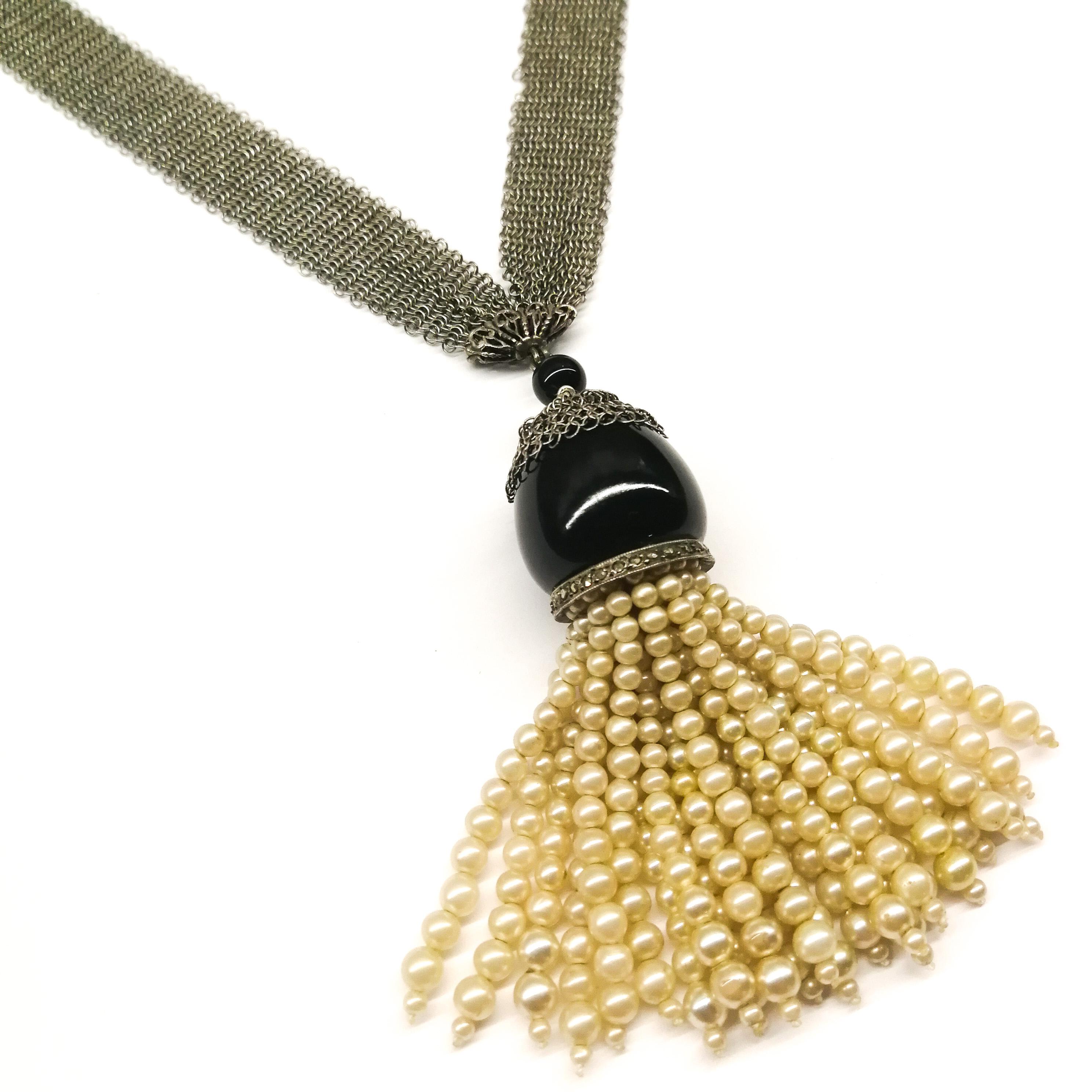 A charming sautoir, made from a delicate silver mesh chain - with a full tassel of cream colored paste pearls, onyx and marcasite, set in silver, suspended from the bottom of the chain. The mesh chain is very fine and fluid, with a small mesh 'cap'