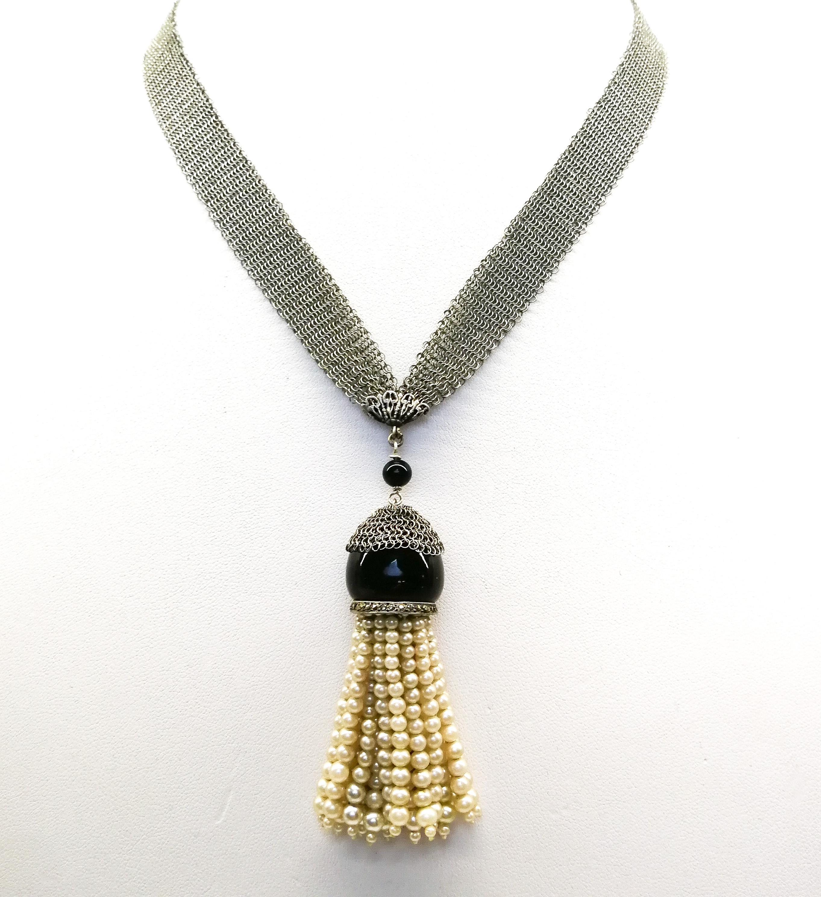 Bead A very fine silver mesh, onyx, marcasite and paste pearl 'tassel' sautoir, 1920s