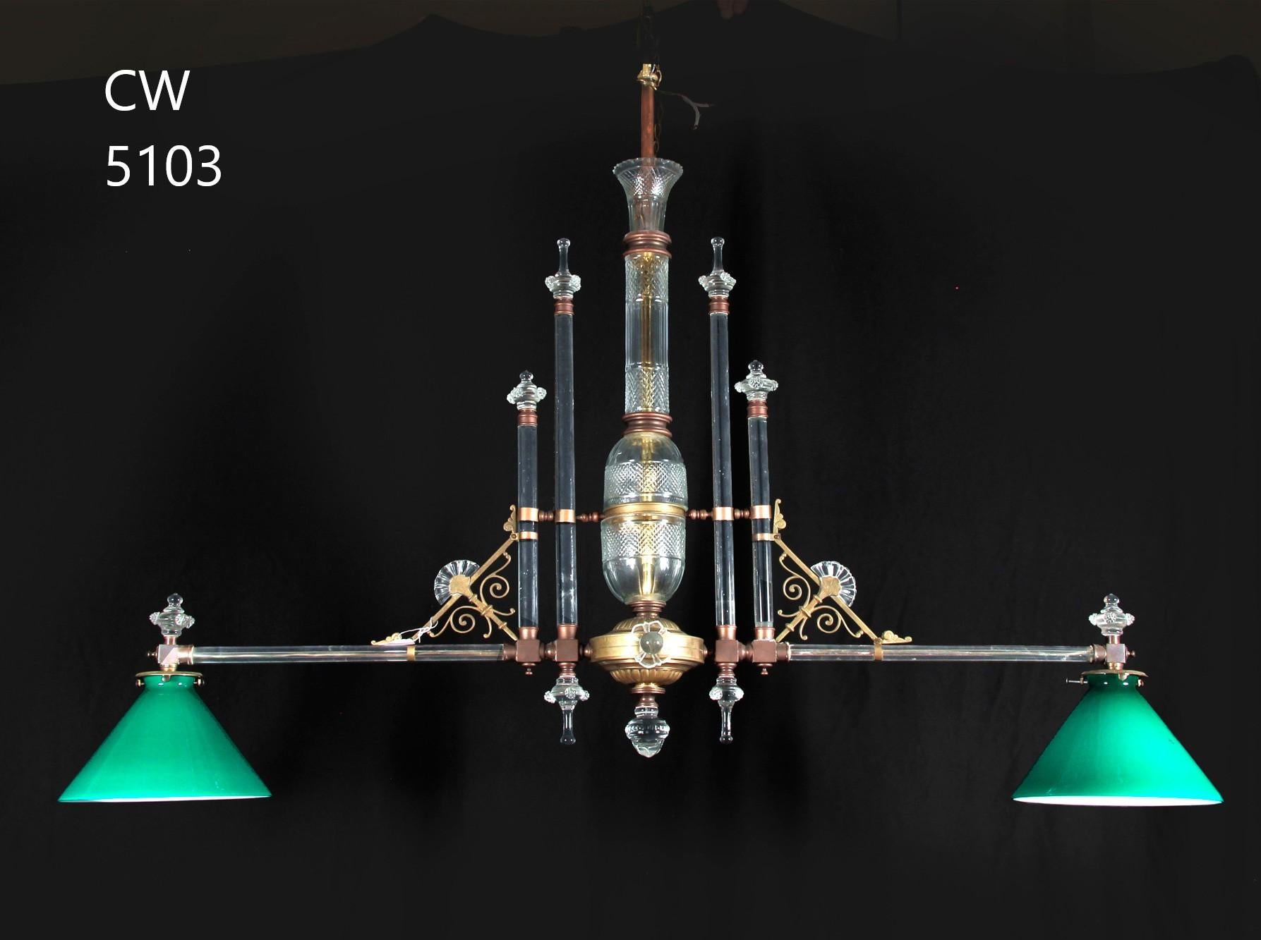 A Very Fine Two Light Crystal Chandelier with two newer green cased glass shades. Fizture England, circa 1910. Shades circa 1950. 
Dimensions: 35