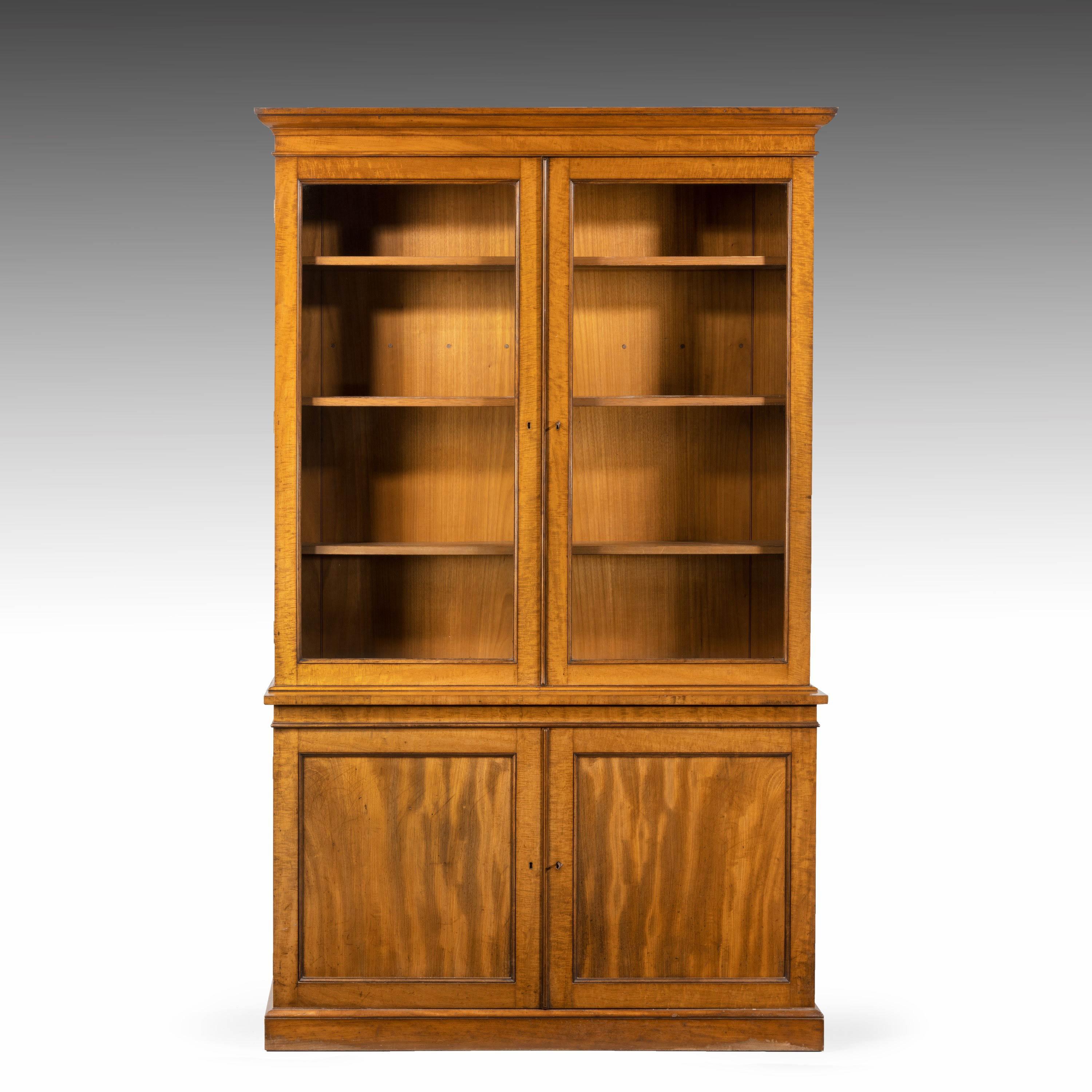 A very good and original mahogany bookcase of good size. With two pane glaze doors over two matching blind doors.
 