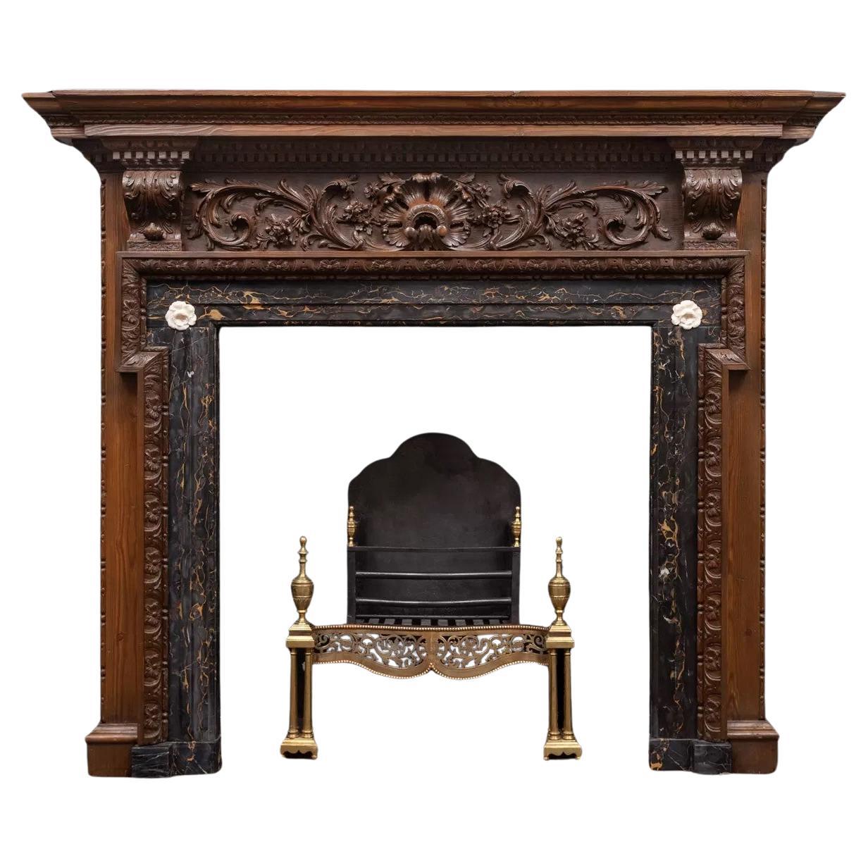 A very good George II carved pine mantel with Portoro marble interior For Sale