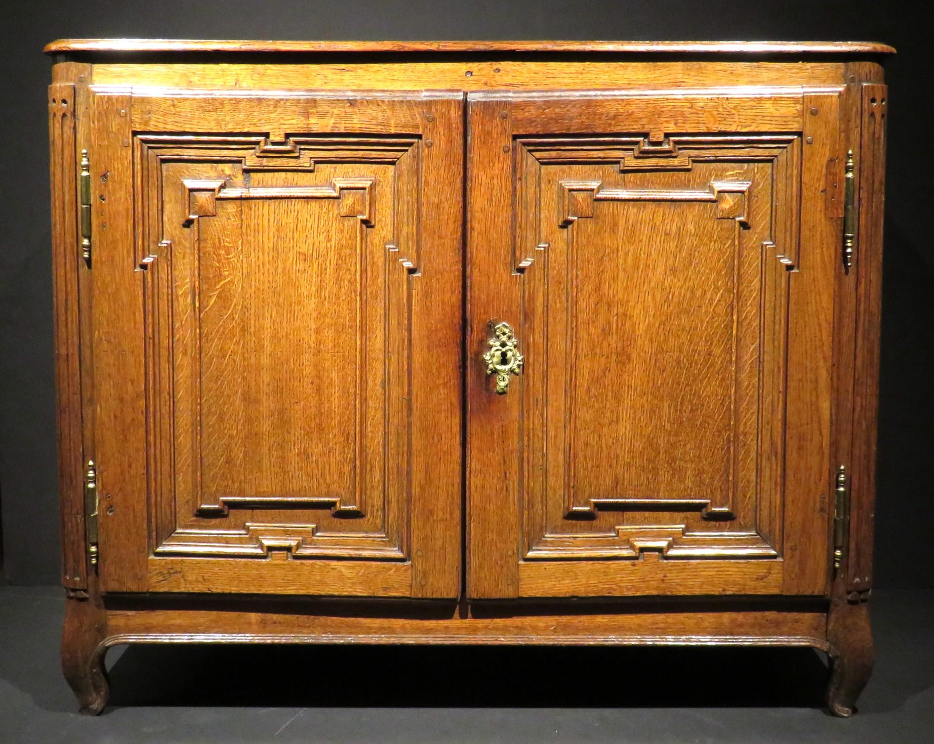 A very handsome & diminutive 18th century Louis XV oak buffet, demonstrating superior form & exacting proportions. The panelled case showing traditional peg-joined mortise & tenon construction, the framed sides inset with floating panels, the front