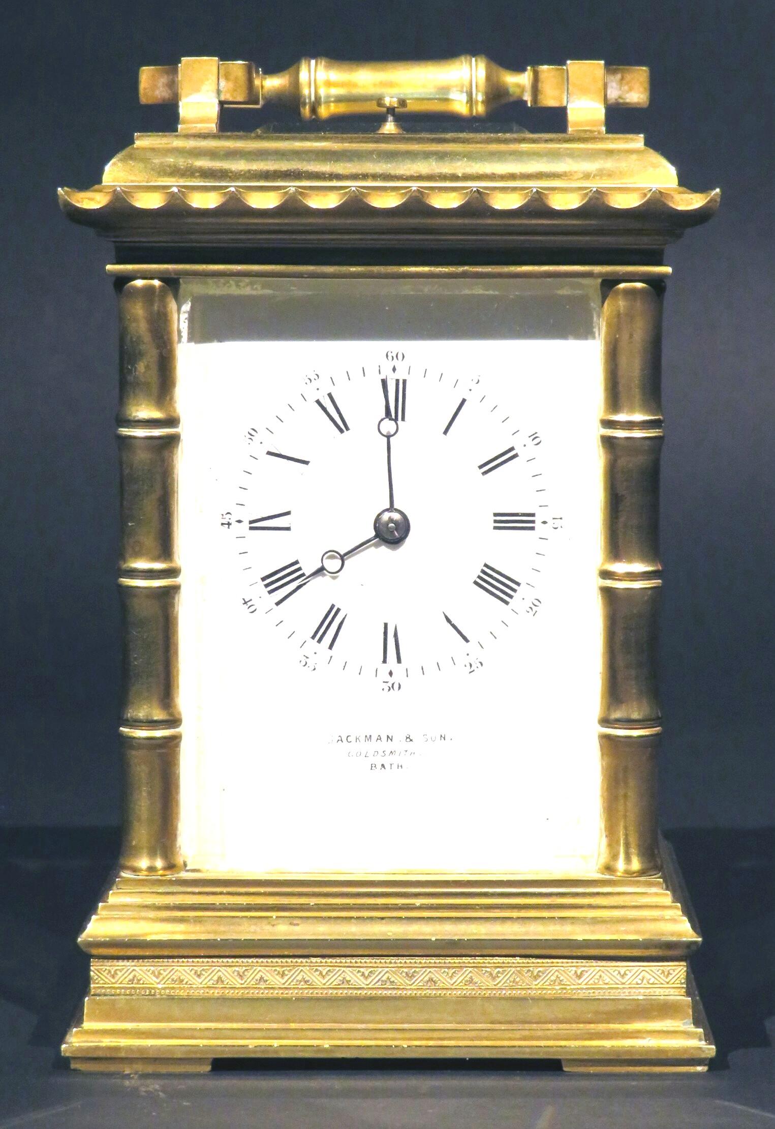 A very handsome & heavy cast 19th century French carriage clock with oriental inspired accents, the case showing stylized bamboo-shaped columns rising to a pagoda-style top fitted with a swing carrying handle and push-tab for the repeat mechanism.