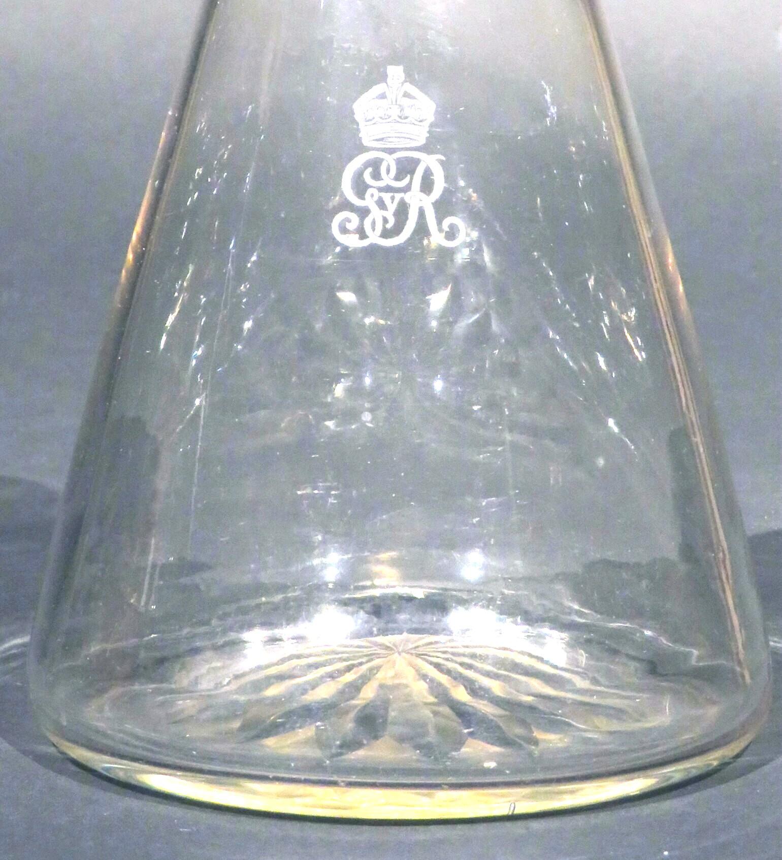 The conical shaped body rising to a tapering neck with broad vertical flutes beneath a flaring rim, the midsection featuring the etched Royal Cypher & Crown for King George V, (reign period 1910-1936), the underside decorated with star cut detail.