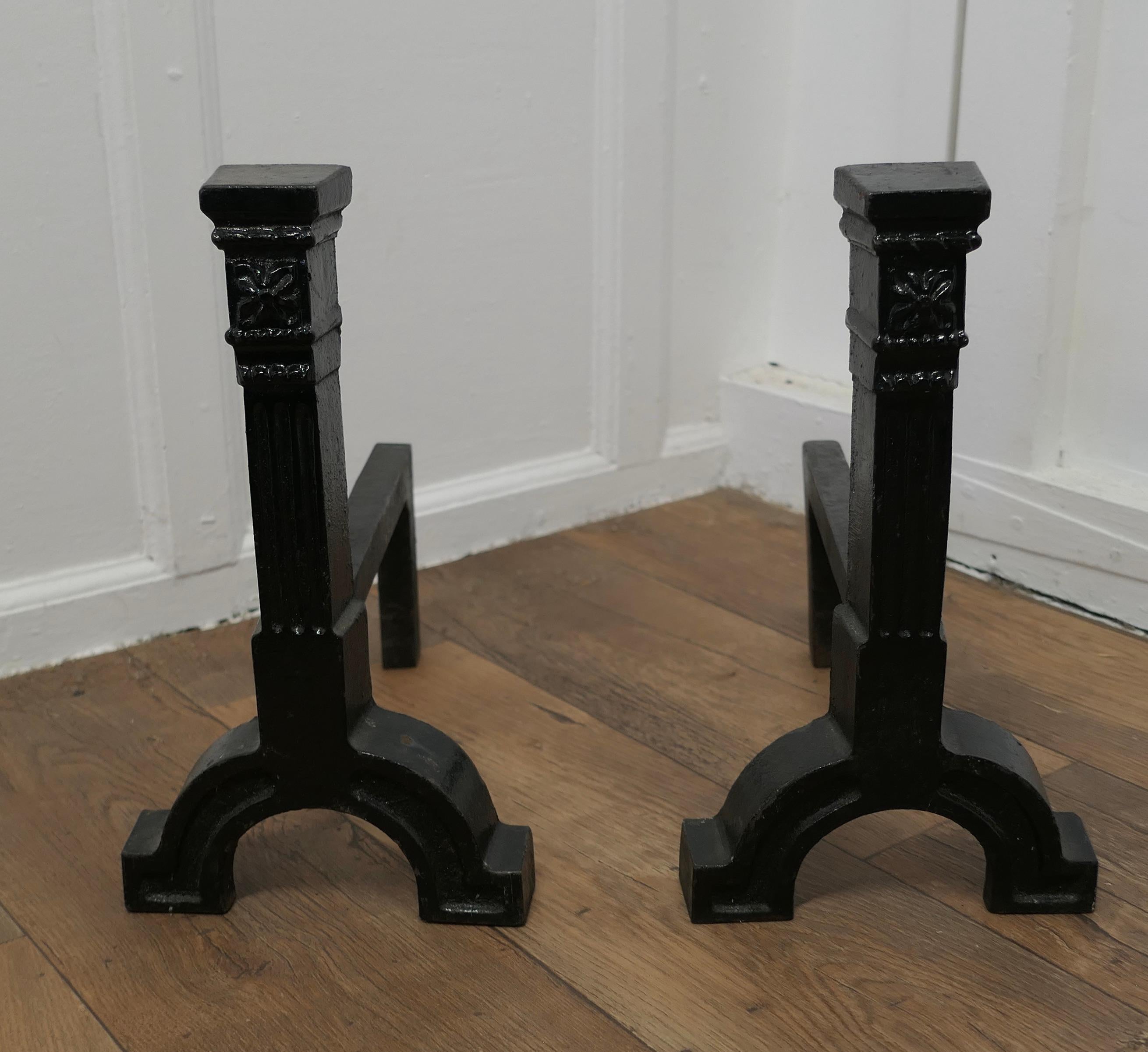 A Very Heavy Pair of 19th Century Iron Andirons or Fire Dogs

This is a Very Heavy pair of Andirons and they are made of cast iron 
The Andirons are 15” high, 14” long and are 8.5” wide at the front
TMS199