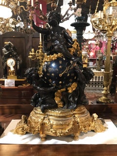 Importantísimo Reloj de Bronce Dorado, Bronce Esmaltado y Bronce Patinado