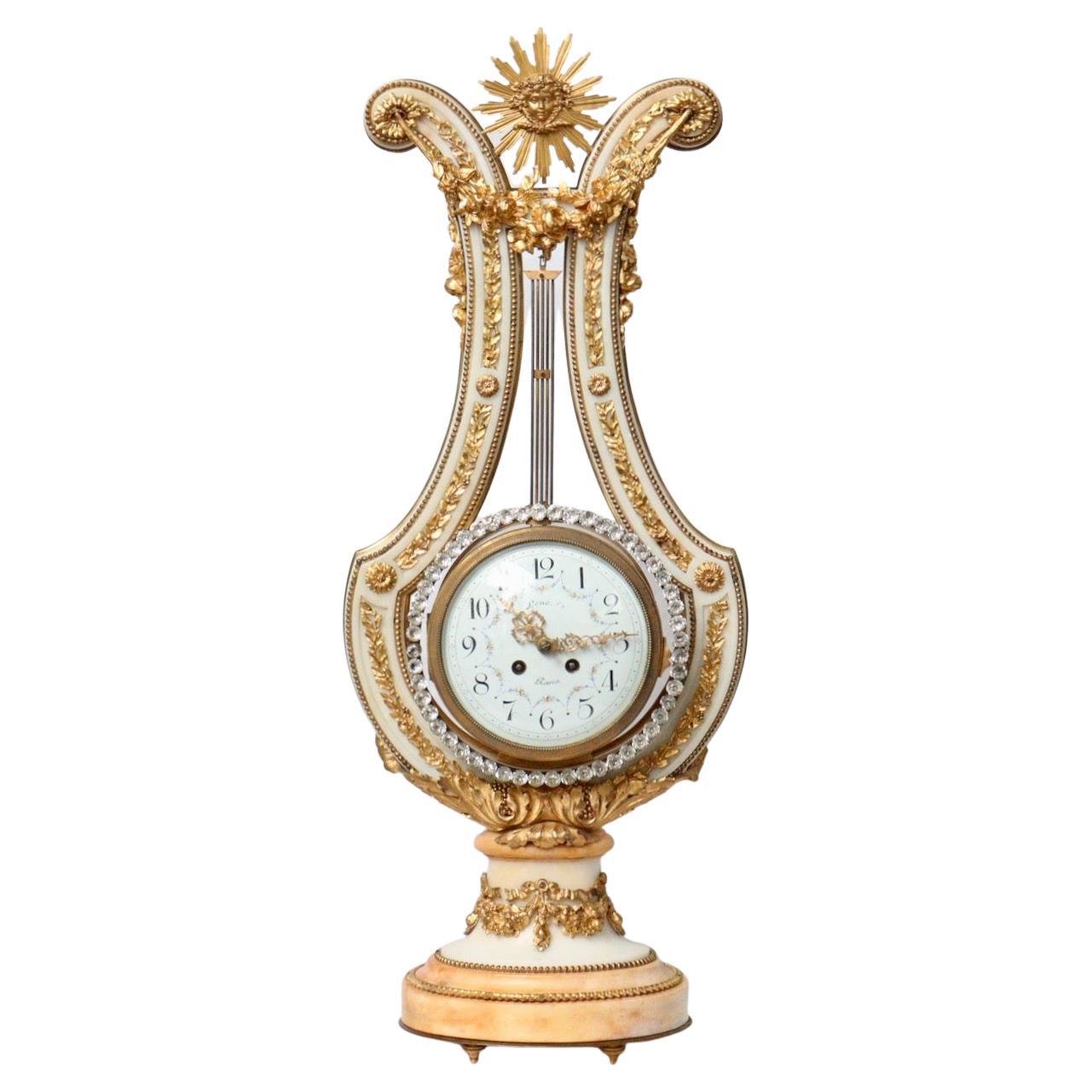 An impressive French 19th century Neoclassical Lyre-form clock with jeweled pendulum.

Amazing quality white and yellow marble 19th century French Lyre-Form clock mounted all over with gilt bronze leaves and swags, draping garlands and Acanthus