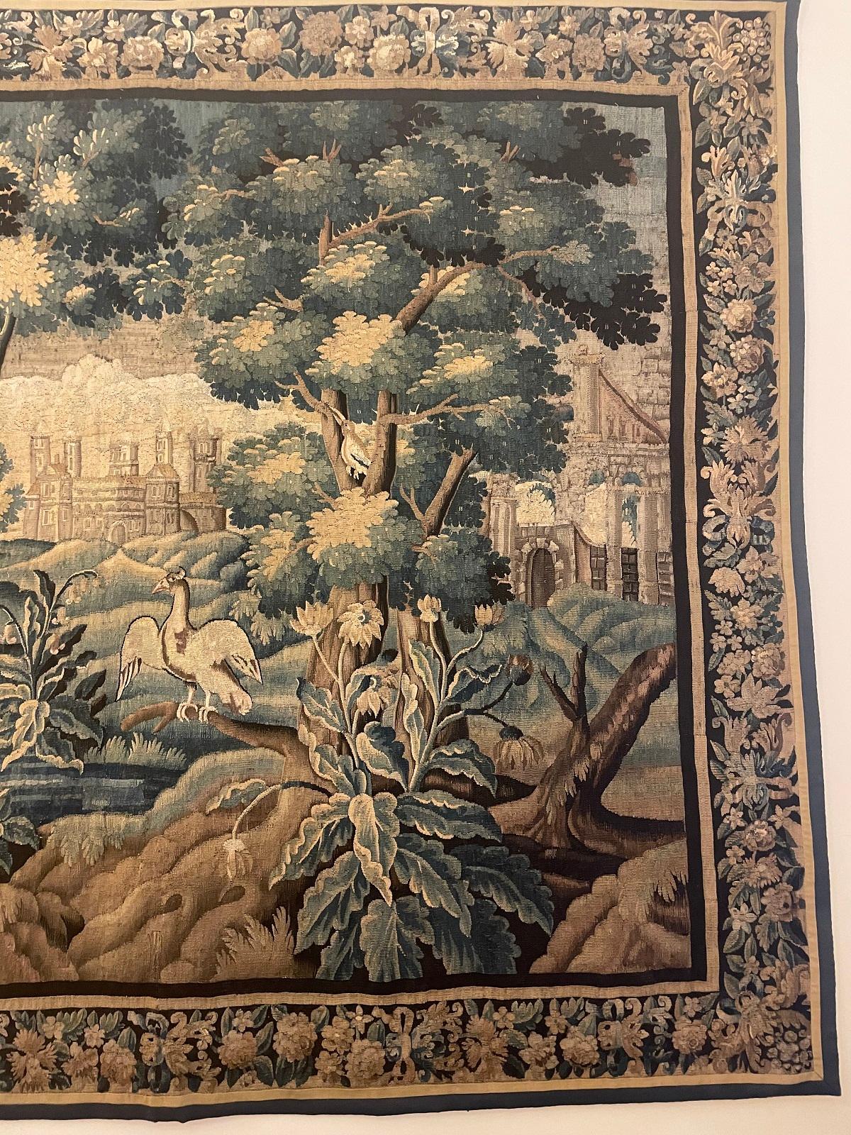 A fine and very impressive Aubusson tapestry from the end of the 17th century representing a very beautiful country landscape with a castles, old runes of a castle, a swan and a hawk 

Tapestry in very good state of conservation which kept very