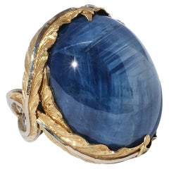 A very large 18 k gold ring with a sapphire.