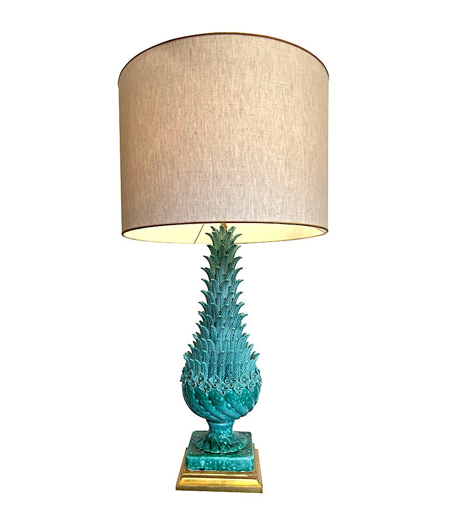 A very large 1950s Spanish ceramic lamp by Ceramicas Bondia of Manises, in rare turquoise colour, mounted on a gilt wooden base with brass fittings and detailing. Ceramicas Bondia with natural coloured linen shade with gold trim. Re wired with new