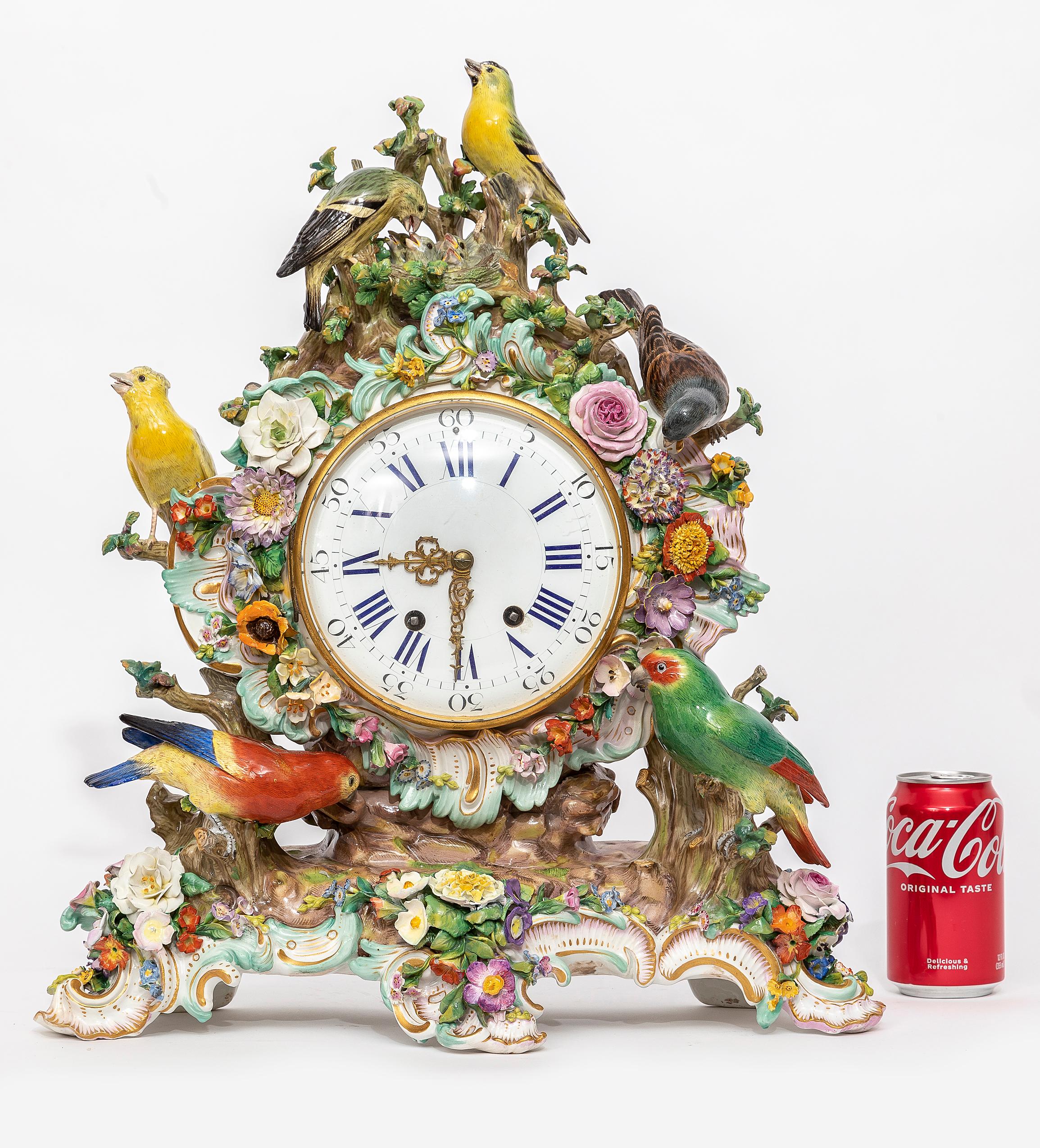 A Very Large and Quite Impressive 19th Century Meissen Porcelain Bird Clock. From the top, a group of baby birds is perched in a nest being fed by their mother with the father bird standing guard.  Each baby birds head is seen pushed up above the