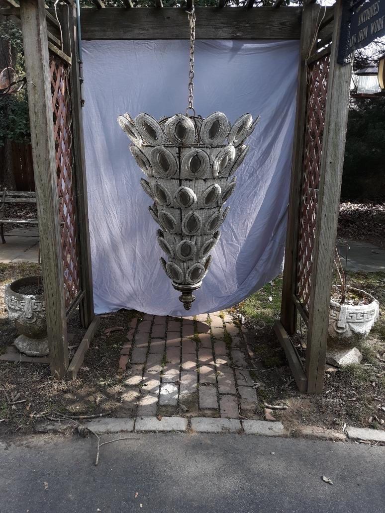 An impressive hand made Italian art glass and beaded cone form chandelier. The steel frame with attached glass beads that surround marquee shaped crystal medallions. A very unique and dramatic light fixture, acquired from a Hamptons Long Island