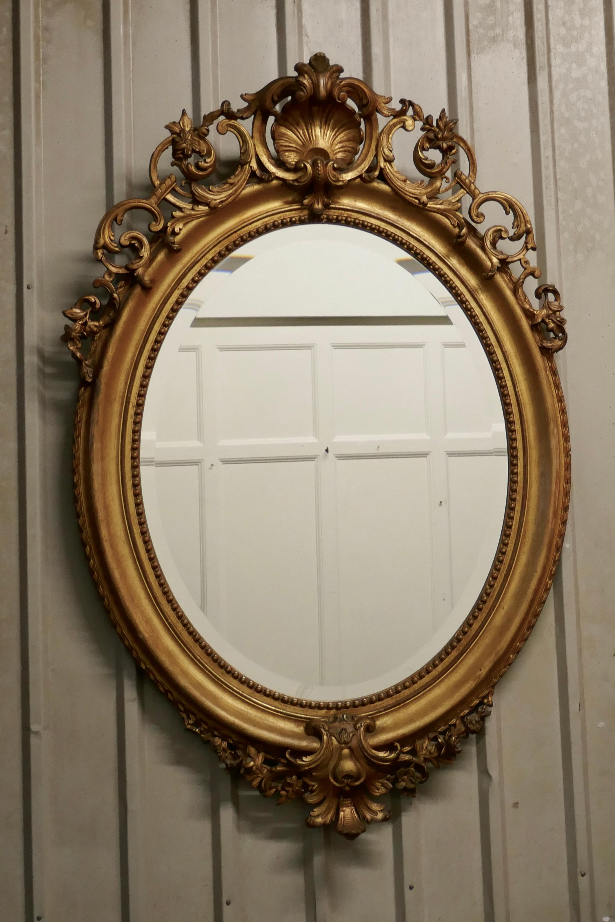 19th Century A Very Large French Rococo Oval Gilt Wall Mirror    For Sale