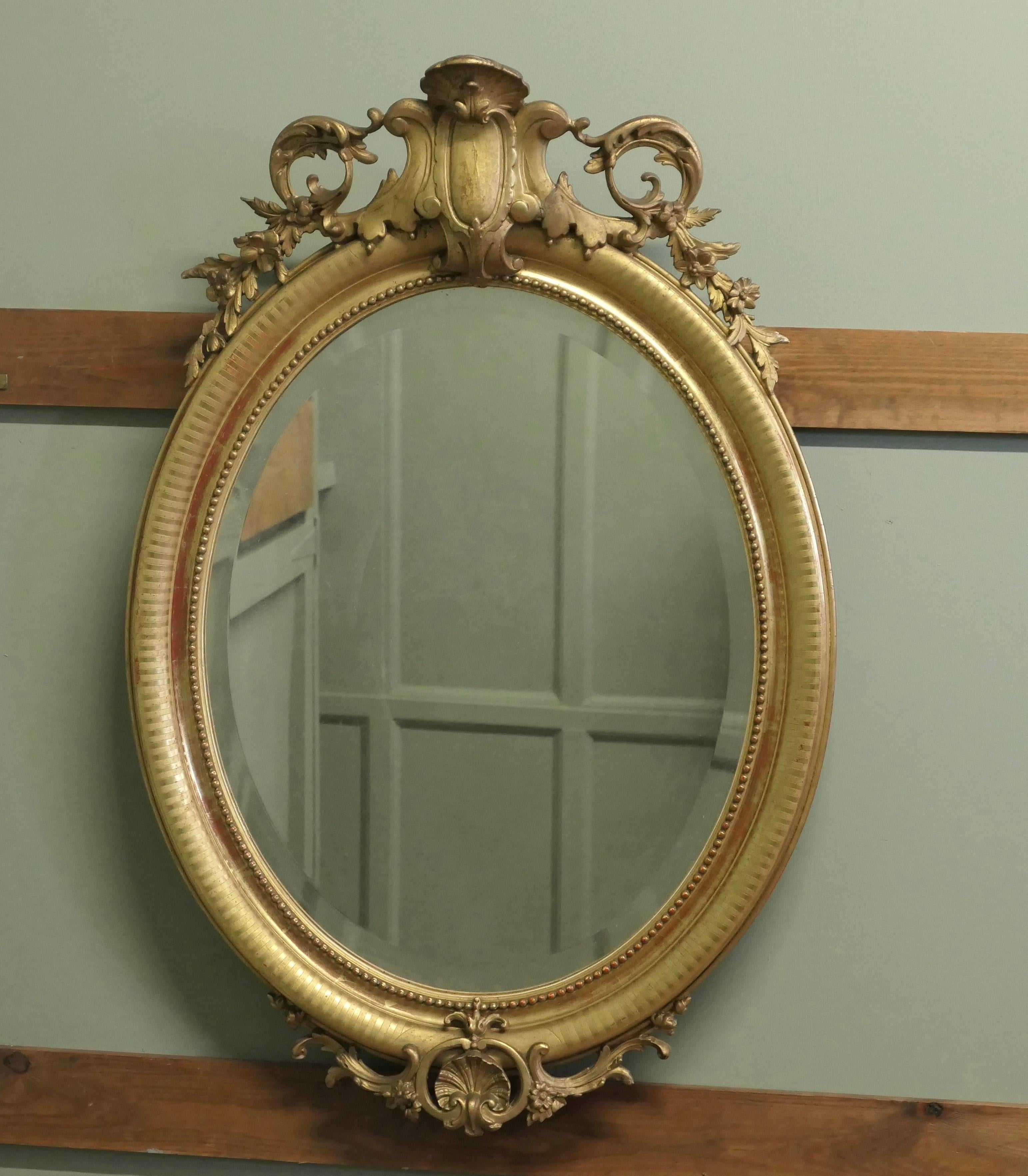 Espejo de pared ovalado dorado French Rococo muy grande en Bueno estado para la venta en Godshill, Isle of Wight