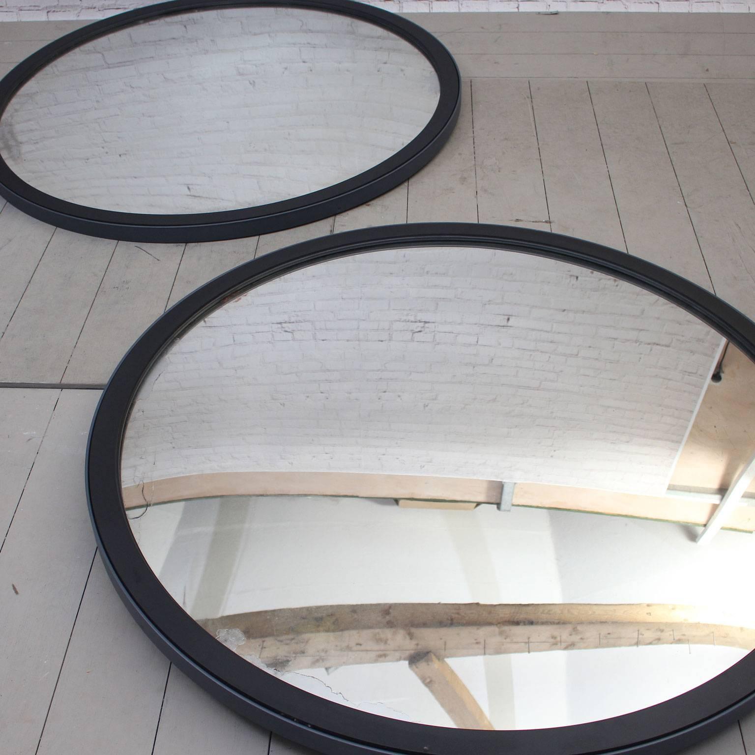 This fabulous, very large 1950s convex mirror was originally used in Eastern European railway stations. We have had it framed in painted steel and wood. The convex is very subtle making this mirror very much useable.
Price is for each mirror.

 