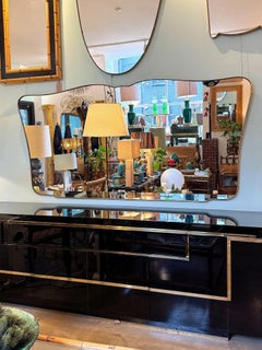 A very large orignal, Italian 1950s solid brass framed, shaped landscape mirror