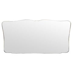 A very large orignal, Italian 1950s solid brass framed, shaped landscape mirror