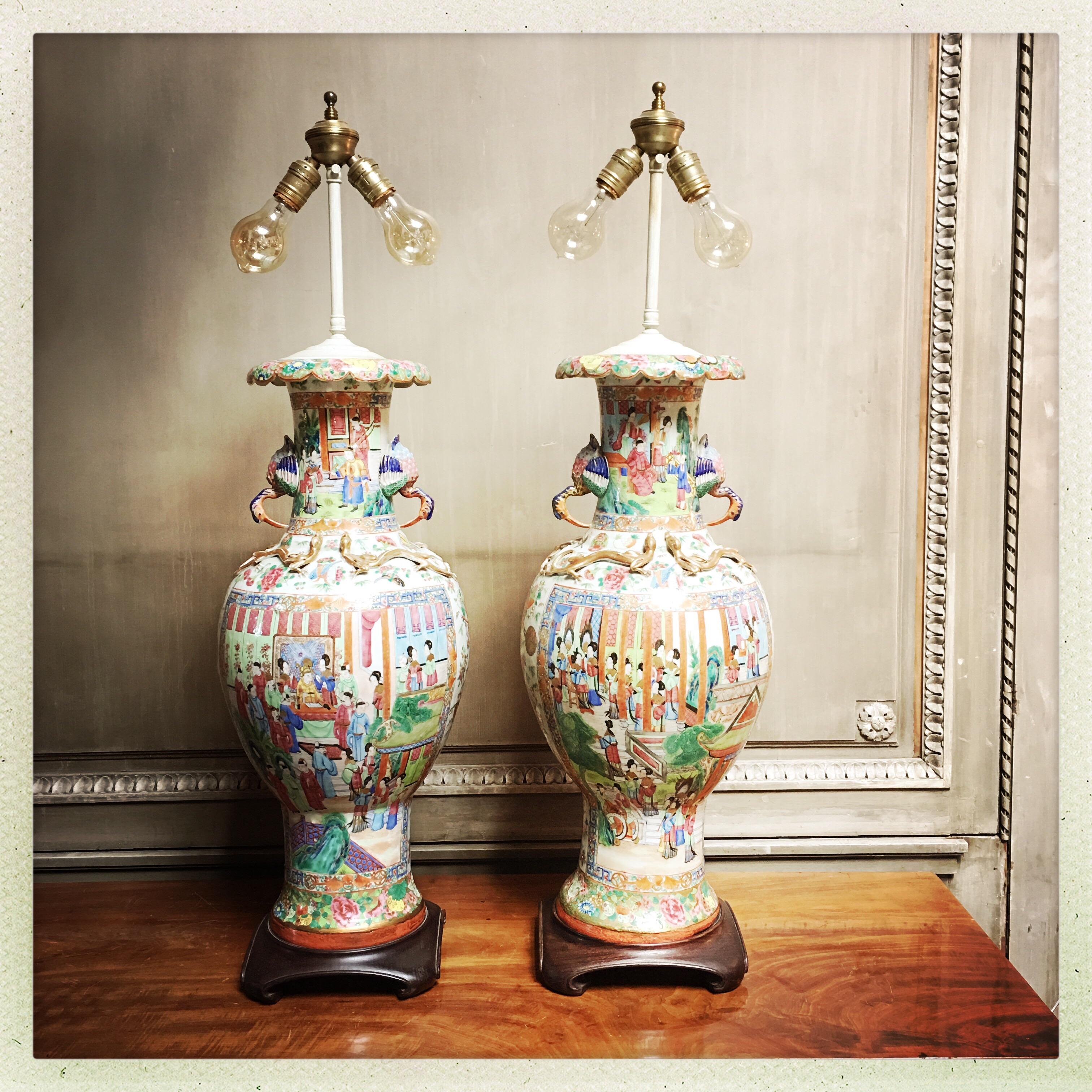 A very large pair of 19th century Chinese Canton export porcelain vases mounted as lamps. Restorations on bases of the porcelains and possibly elsewhere. Very good quality.