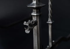 Very Large Pair of Polished Steel Andirons in the Gothic Manner