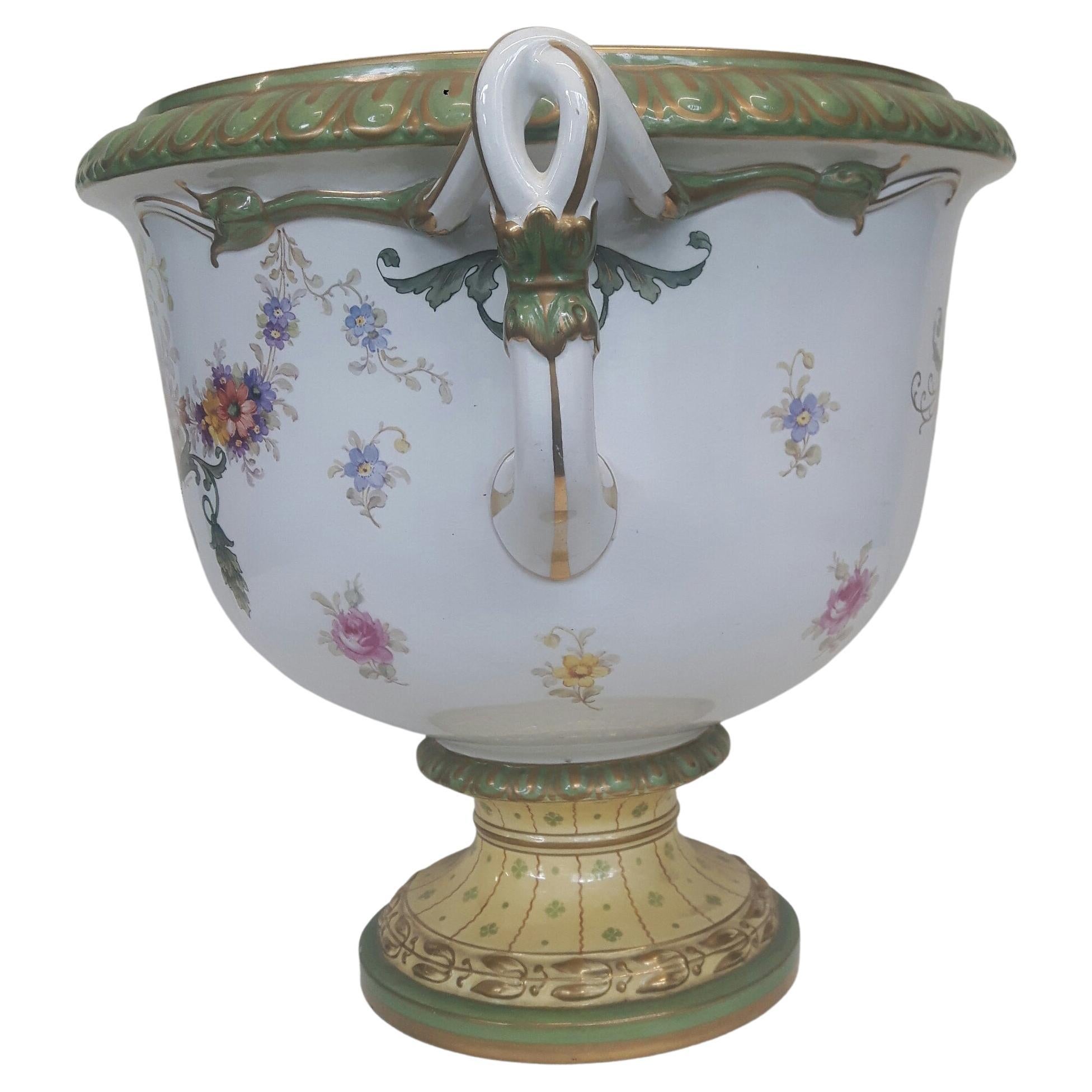 A very large two-handled Royal Bonne Jadiner, delicately painted with elaborate bouquets of flowers, reverse painted with scrolling leaf design on a circular base.