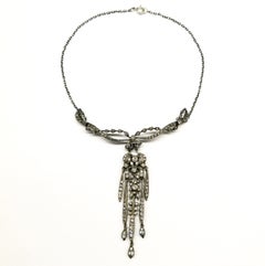 A very pretty silver and paste articulated 'cascade' necklace, English, c1900s