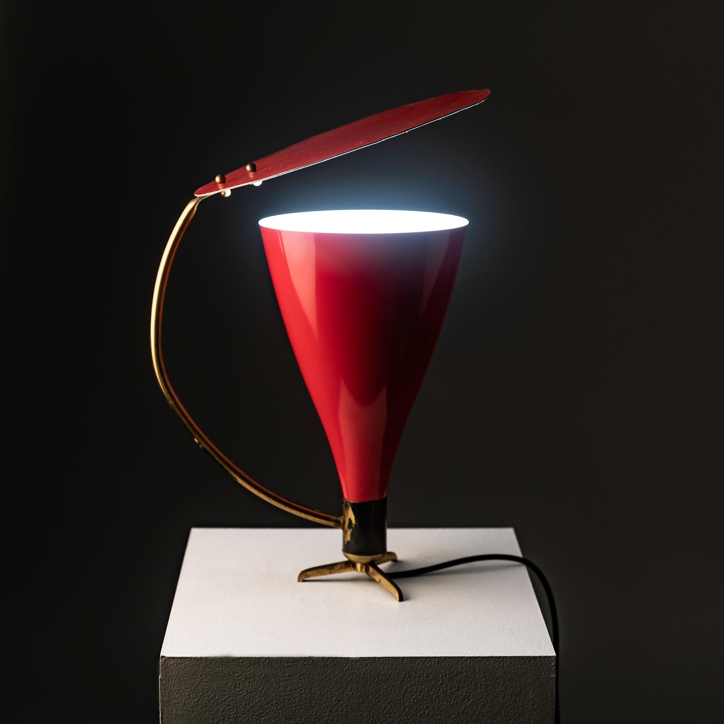 Investing in this very rare 1950s Italian table lamp in the style of Stilnovo presents a remarkable opportunity to acquire a piece of design history that exudes elegance and sophistication. Stilnovo's influence on mid-century design is unmistakable,
