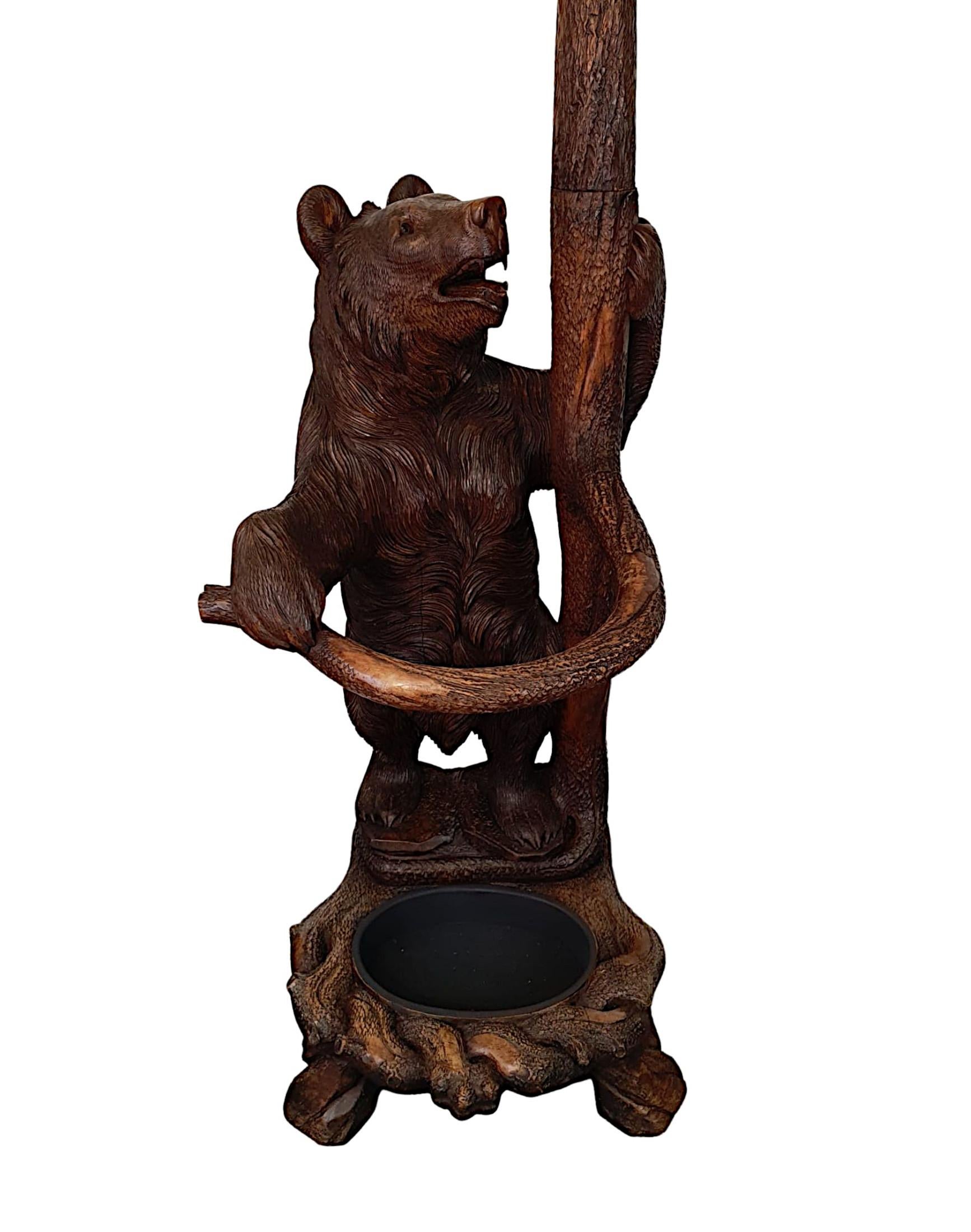 A very rare museum quality 19th Century Black Forest Bear coat or stick stand, comprising of two magnificently hand carved bears executed with incredible workmanship and attention to detail. The mother bear is set within the tree branches,