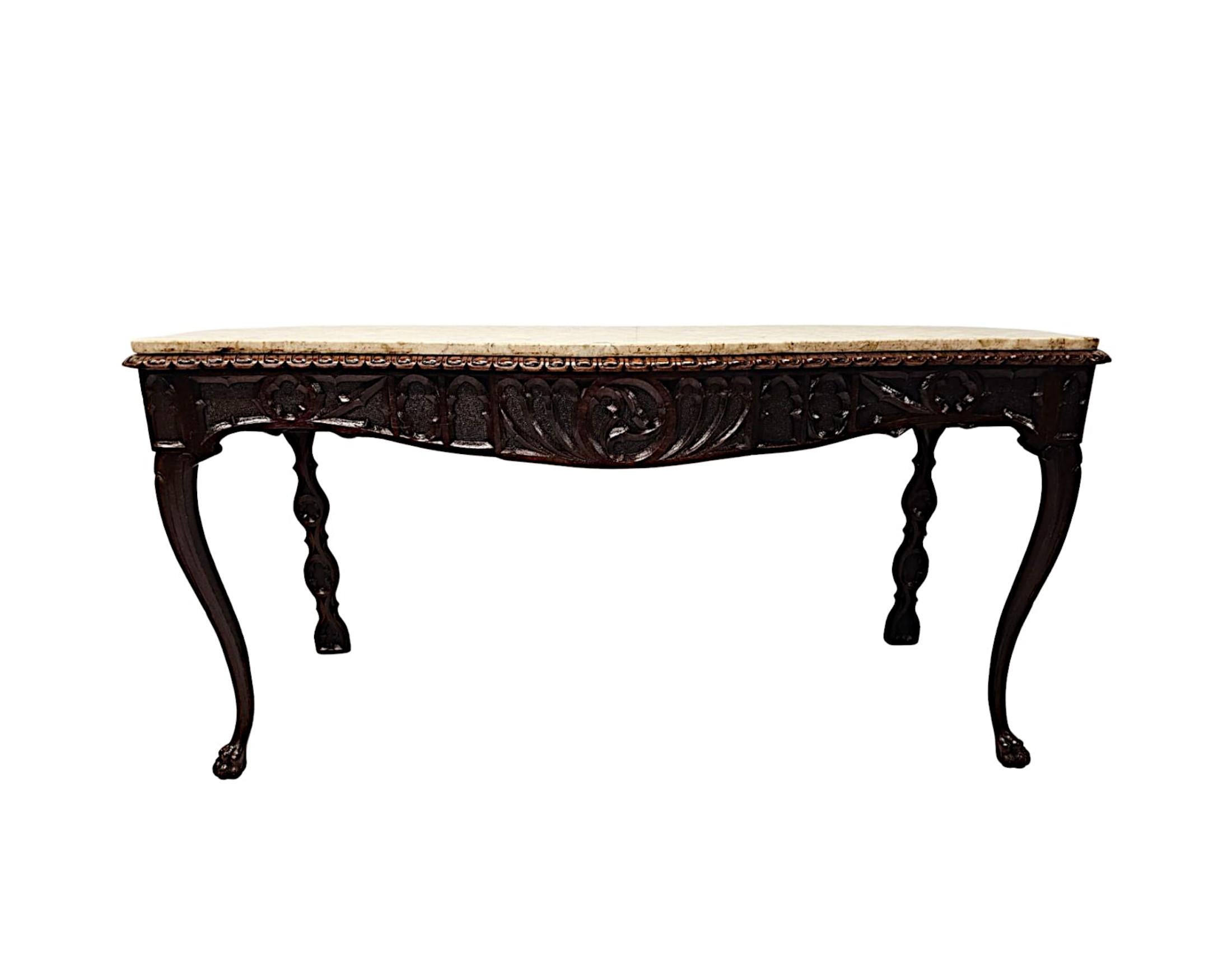 A very rare and fine 19th Century Irish Gothic oak hall or console marble top table, of exceptional quality and beautifully hand carved with rich patination, grain and with intricately carved blind fretwork detail throughout.  The gorgeous, moulded