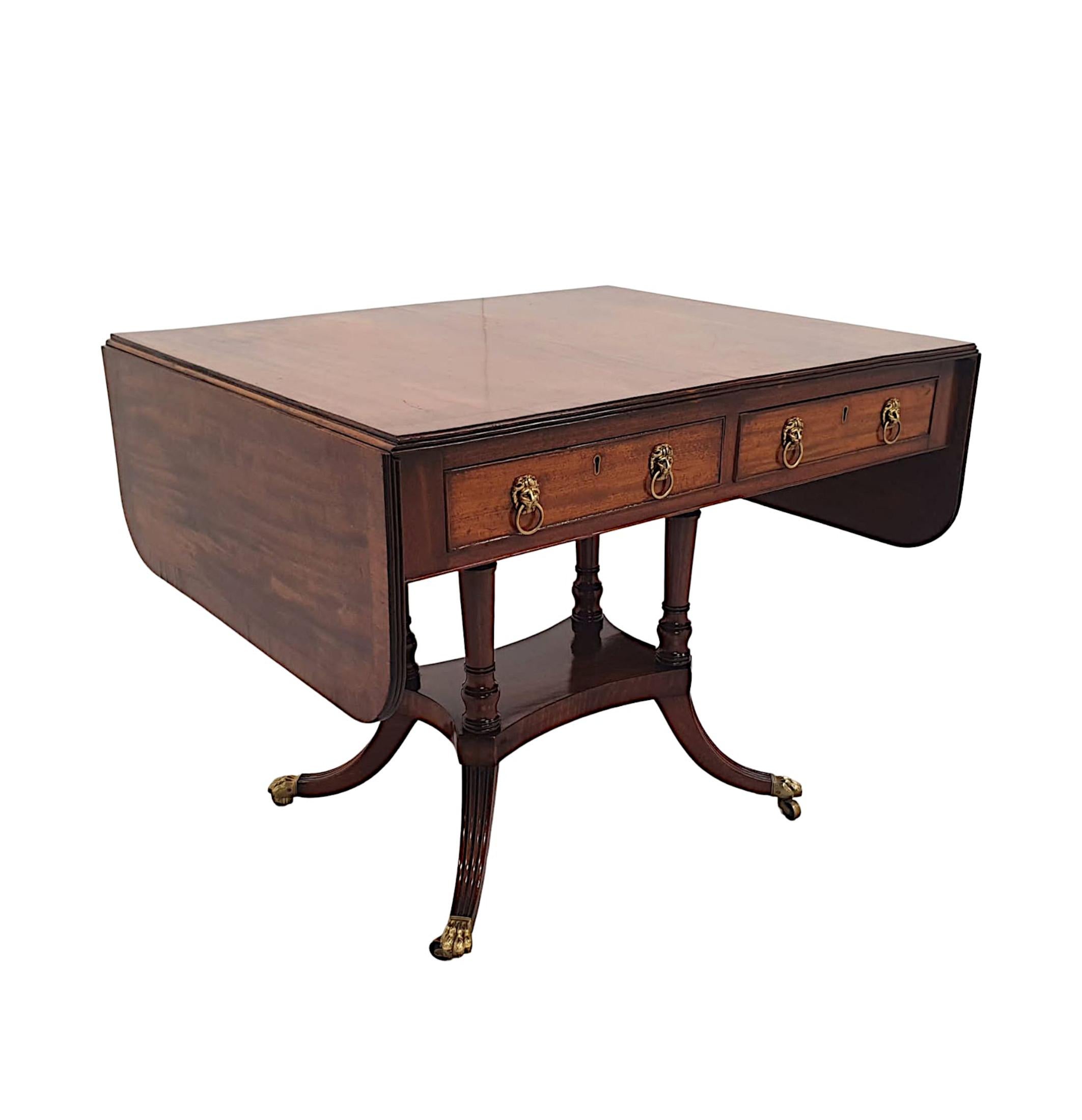 A very rare and fine Irish Georgian mahogany sofa table stamped 'Gillington of Dublin', finely hand carved and of exceptional quality with rich patination and grain.  The well figured moulded top, crossbanded with rosewood of rectangular form with