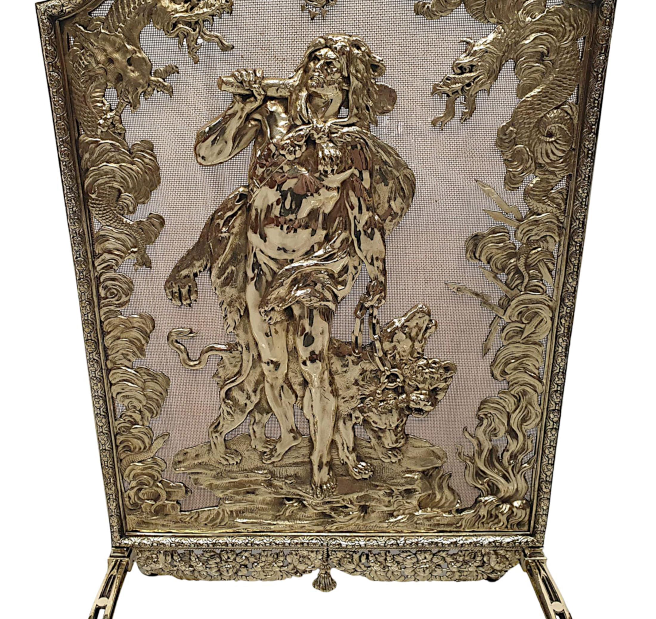 A very rare and fine 19th Century brass fire screen, of exceptional quality, fully restored and of grand proportions. The protective wire mesh of shaped, rectangular form is set within a fabulously detailed polished, cast brass frame with beautiful