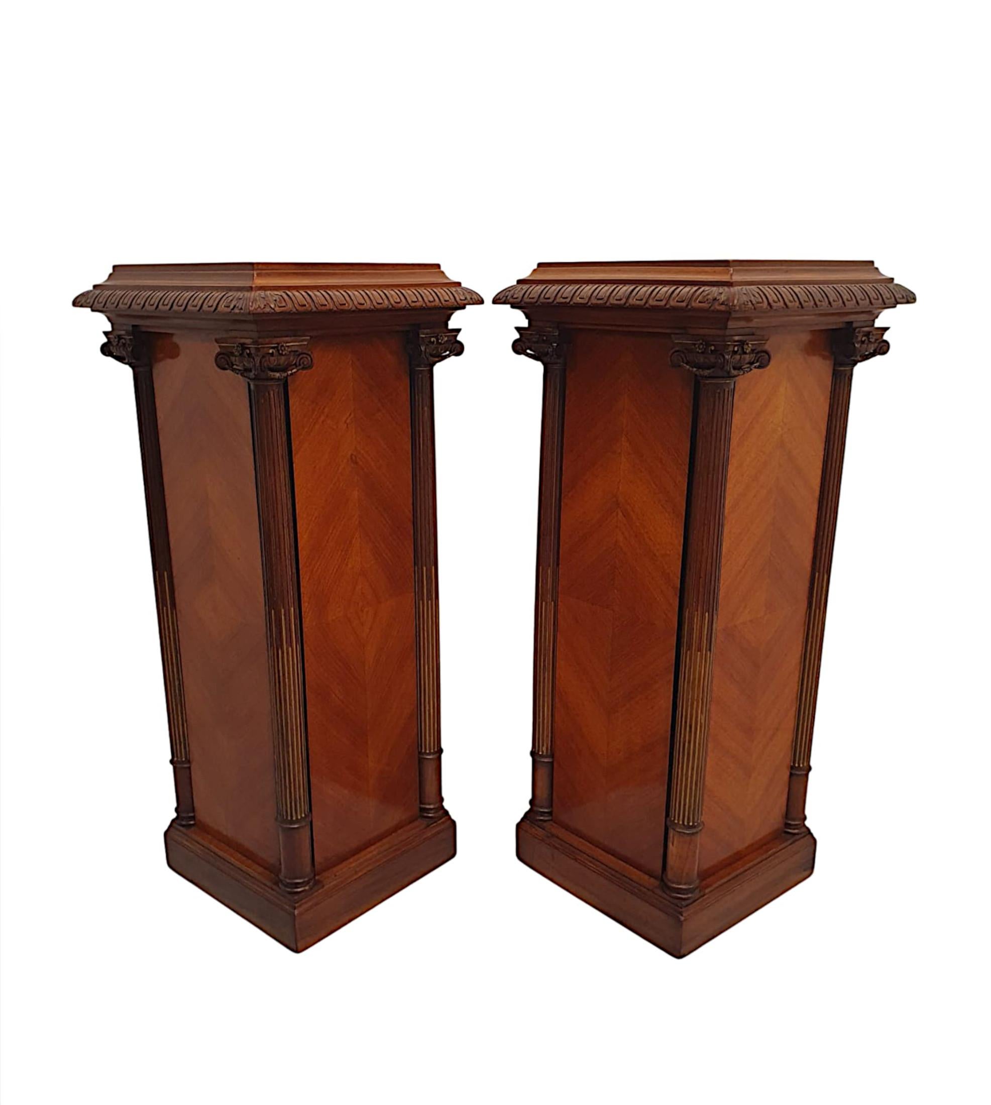 A very rare and fine pair of 19th Century kingwood and walnut bust or plant stands, of exceptional quality and fabulously hand carved with quarter veneered detail and beautifully rich patination and grain throughout.  The well figured, moulded top
