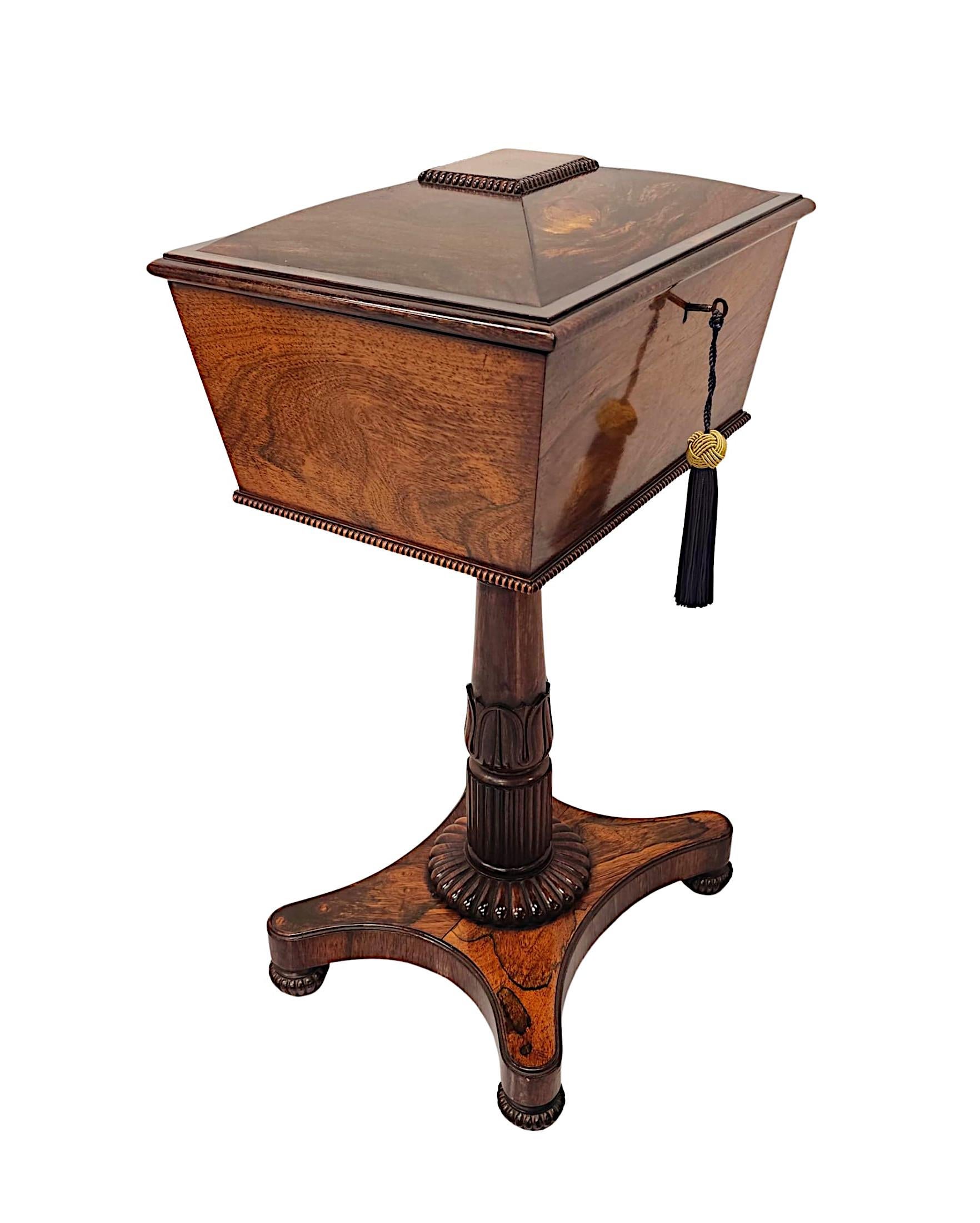 A very rare early 19th Century Regency fruitwood teapoy of exceptional quality, finely hand carved with gorgeously rich patination and fine grain.  The well figured, moulded and quarter veneered hinged top of sarcophagus form with decorative gadroon
