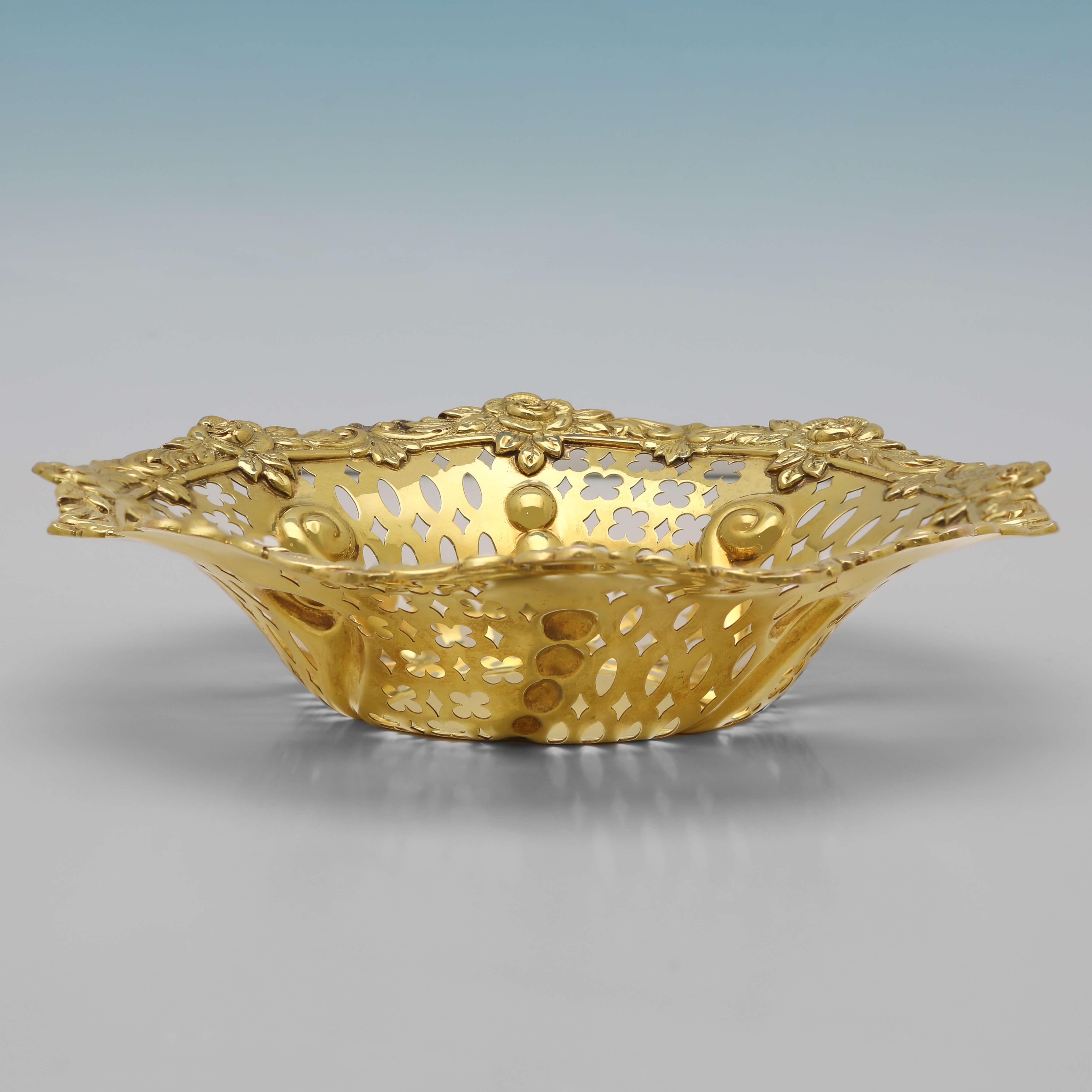 Hallmarked in London in 1903 by Mappin & Webb, this very pretty, Edwardian, Antique 9ct Gold Dish, features pierced sides, and a cast and applied border. 

The dish measures 1.5