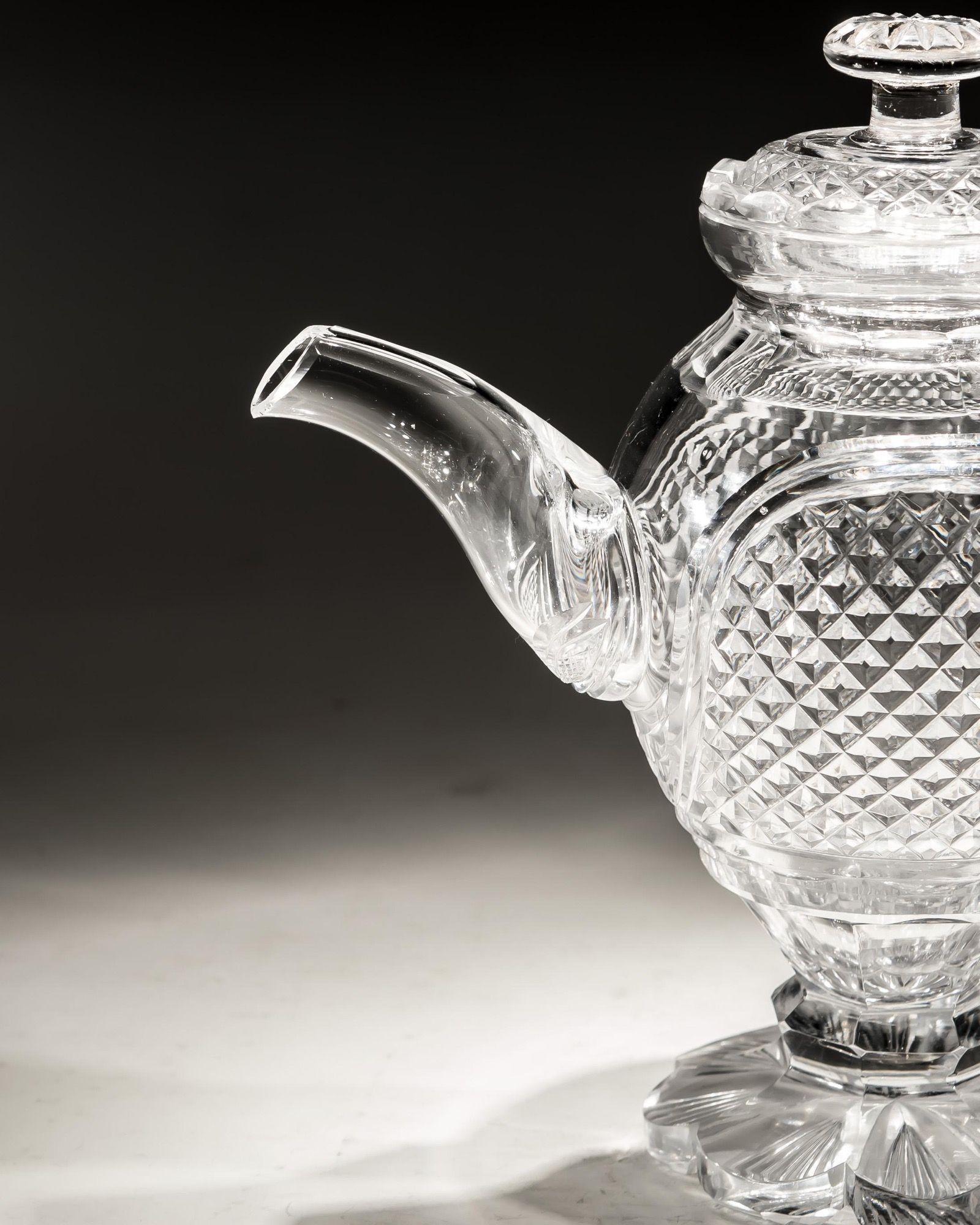 A very rare diamond cut, glass teapot on pedestal foot.