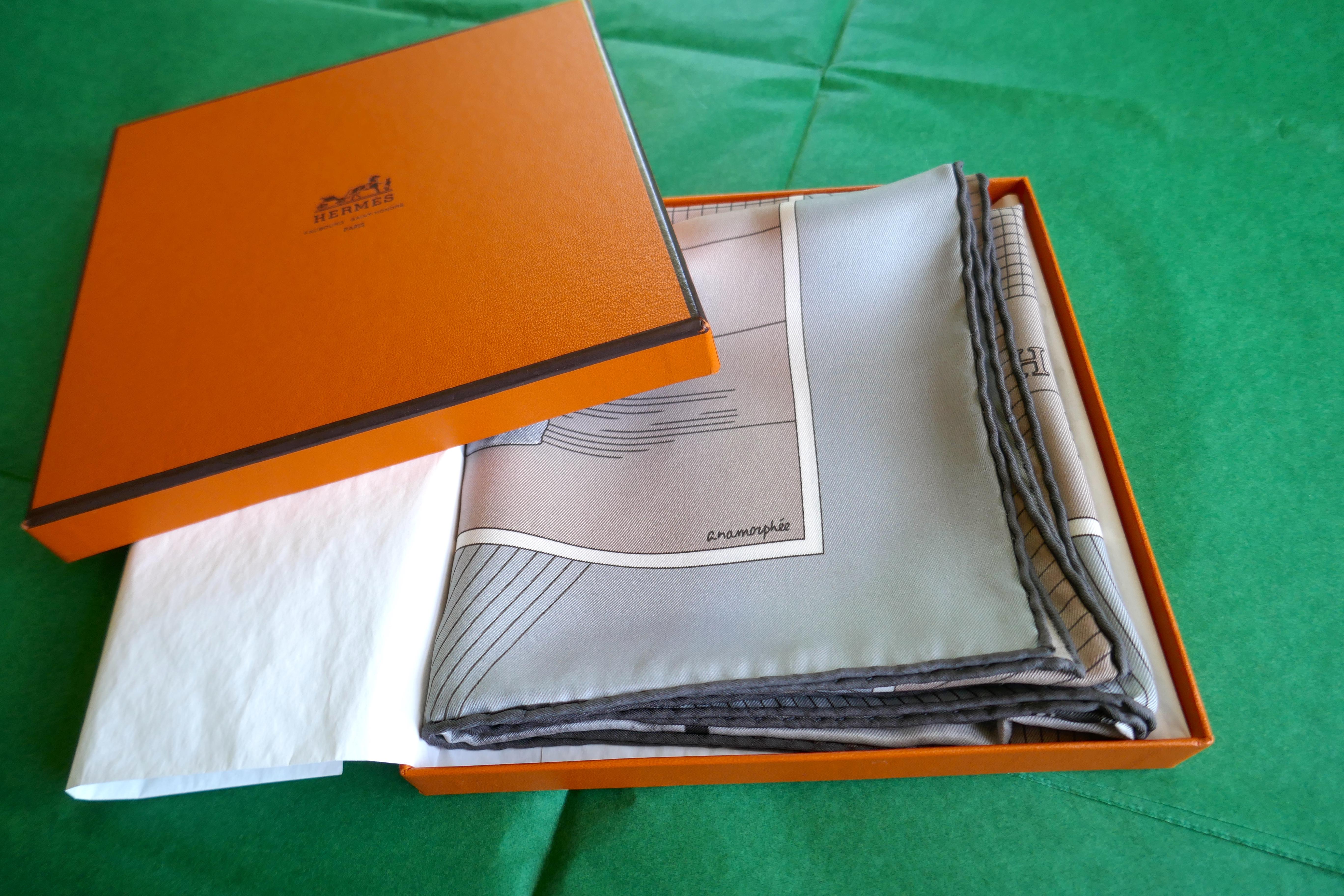 A Very Rare Hermes 100% Silk Scarf “H Cheval” by Anamorphée  


Beautiful design “a Grey in harness” in soft colours 
Anamorphée is a company formed by designers Bertrand Houdin & Charlotte Halpern
Unworn and safely stored away in its box and acid