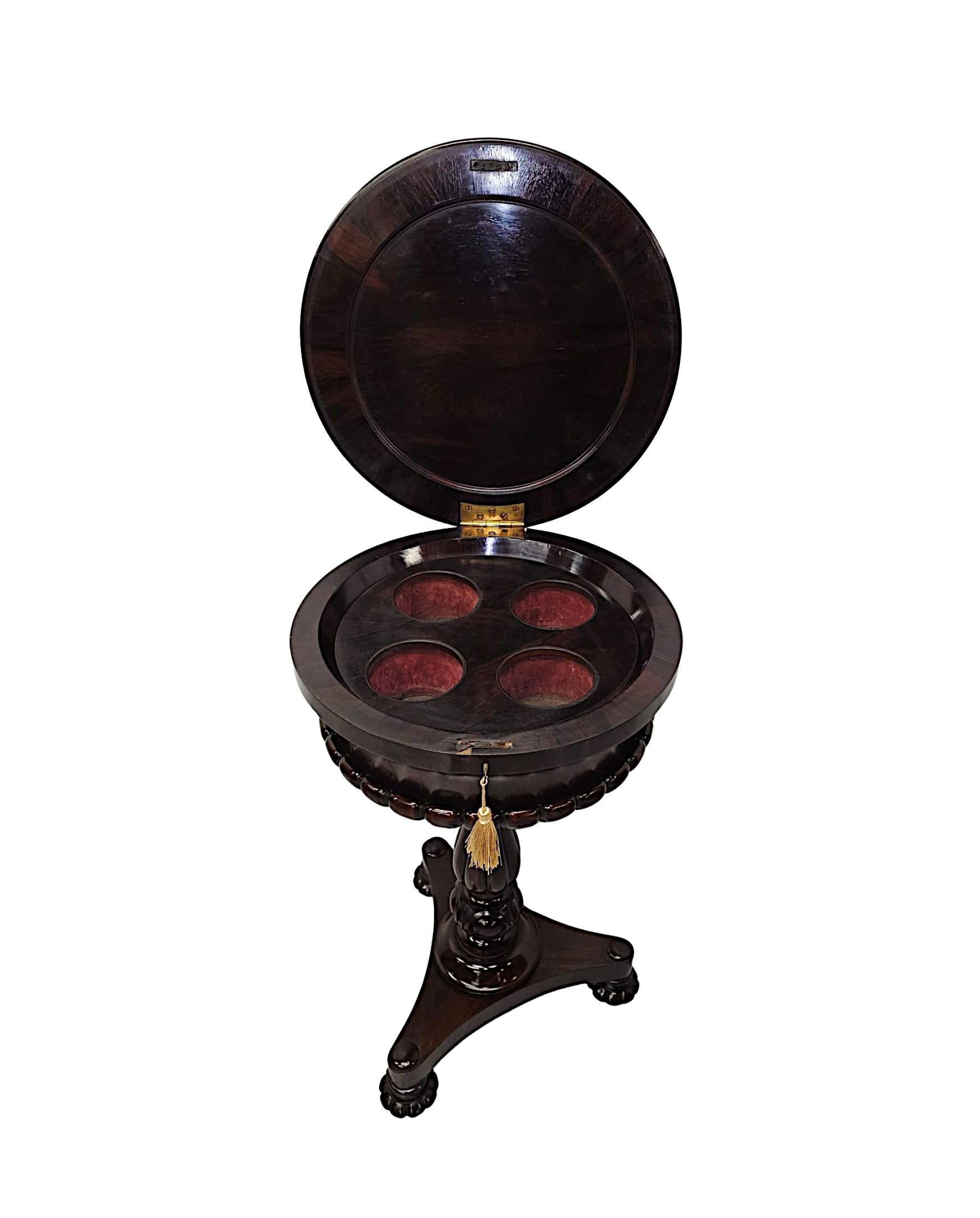 A very rare early 19th Century Irish William IV well figured rosewood teapoy of exceptional quality, finely hand carved with beautifully rich patination and fine grain.  The moulded body of circular form with gadroon detail throughout features a