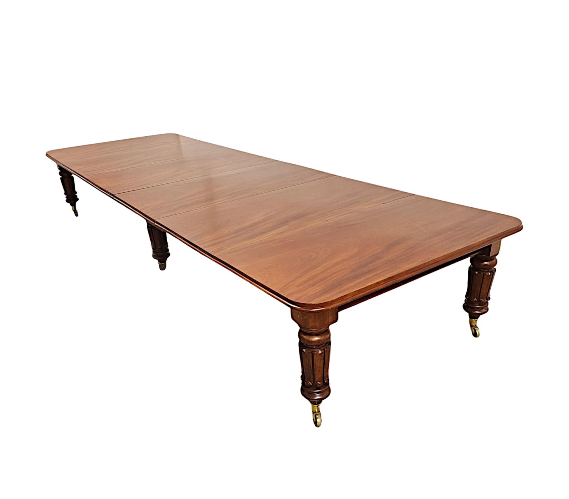 A very rare early 19th Century William IV mahogany extending Country House dining table of grand proportions, finely hand carved with beautifully rich patination and grain.  This stunning piece is of exceptional quality and features six legs, four
