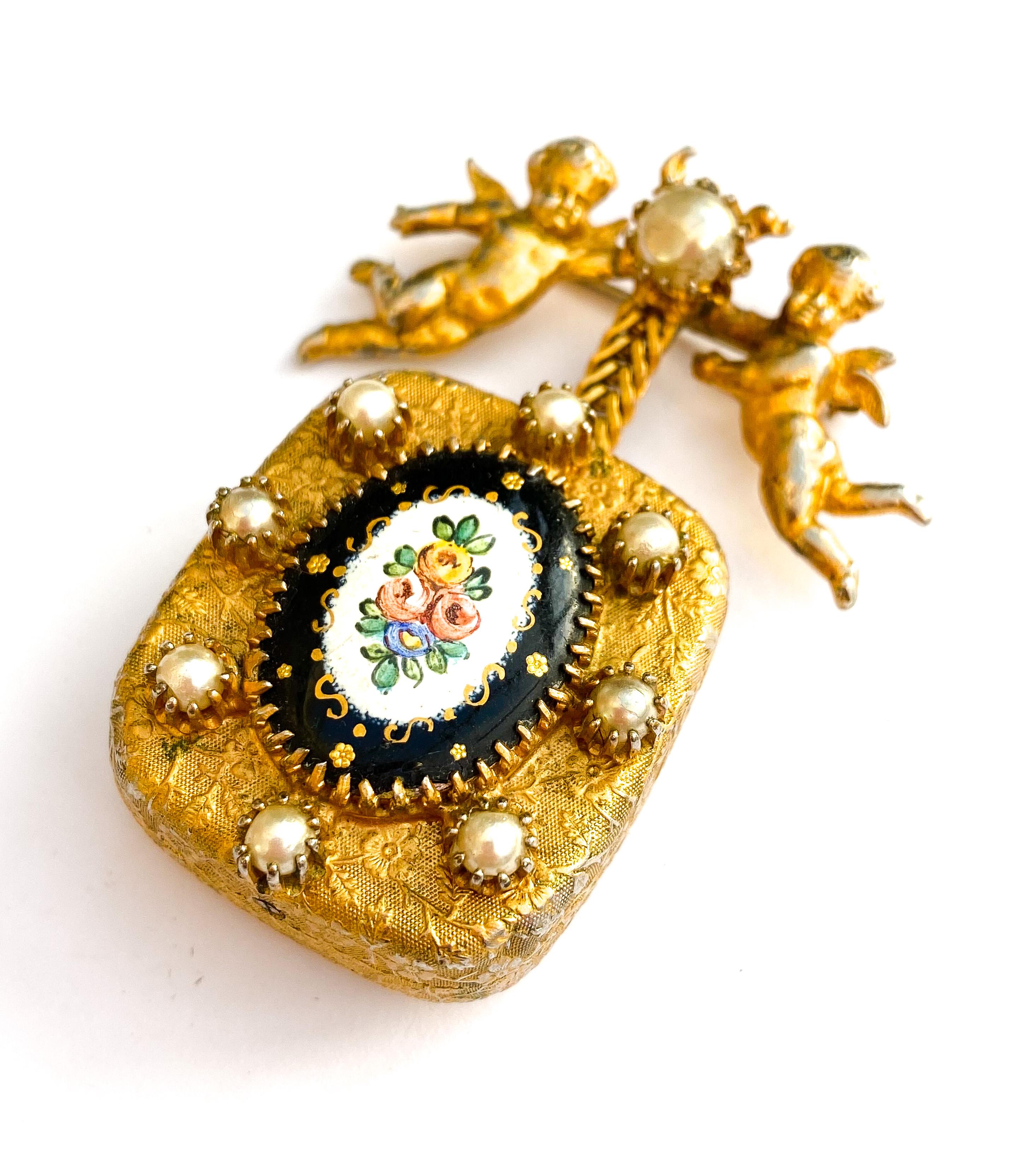A highly collectable and very  desirable jewel by Christian Dior from the early 1950s, made by Mitchel Maer in the early 1950s. This iconic and very rare brooch, so unique and quirky with its musical box element(fully working) is one of the most