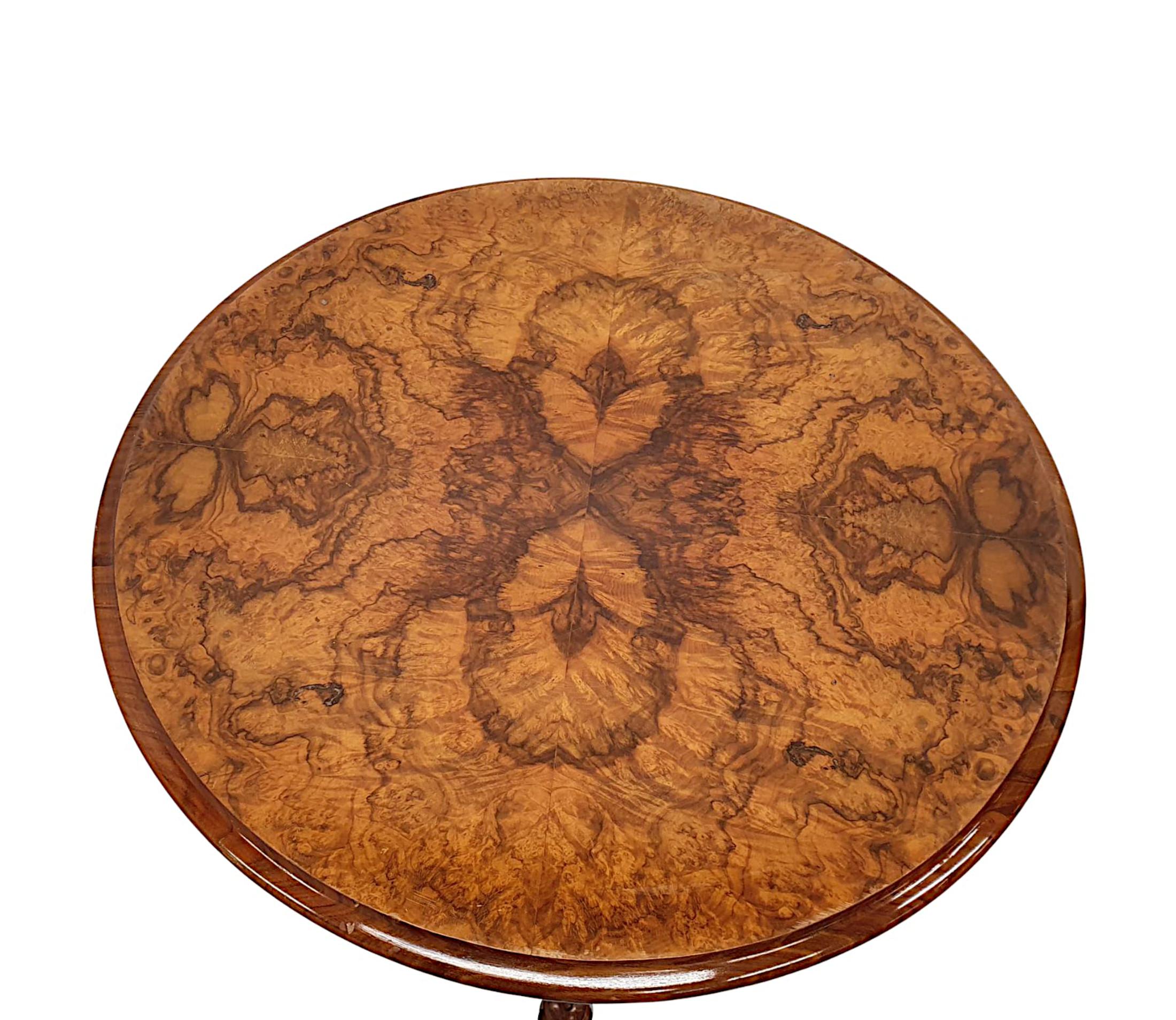 A very rare pair of 19th century burr walnut side, lamp or occasional tables in the manner of Strahan, of exceptional quality, finely hand carved with fabulously rich patination and beautiful grain. The well figured moulded top of circular form