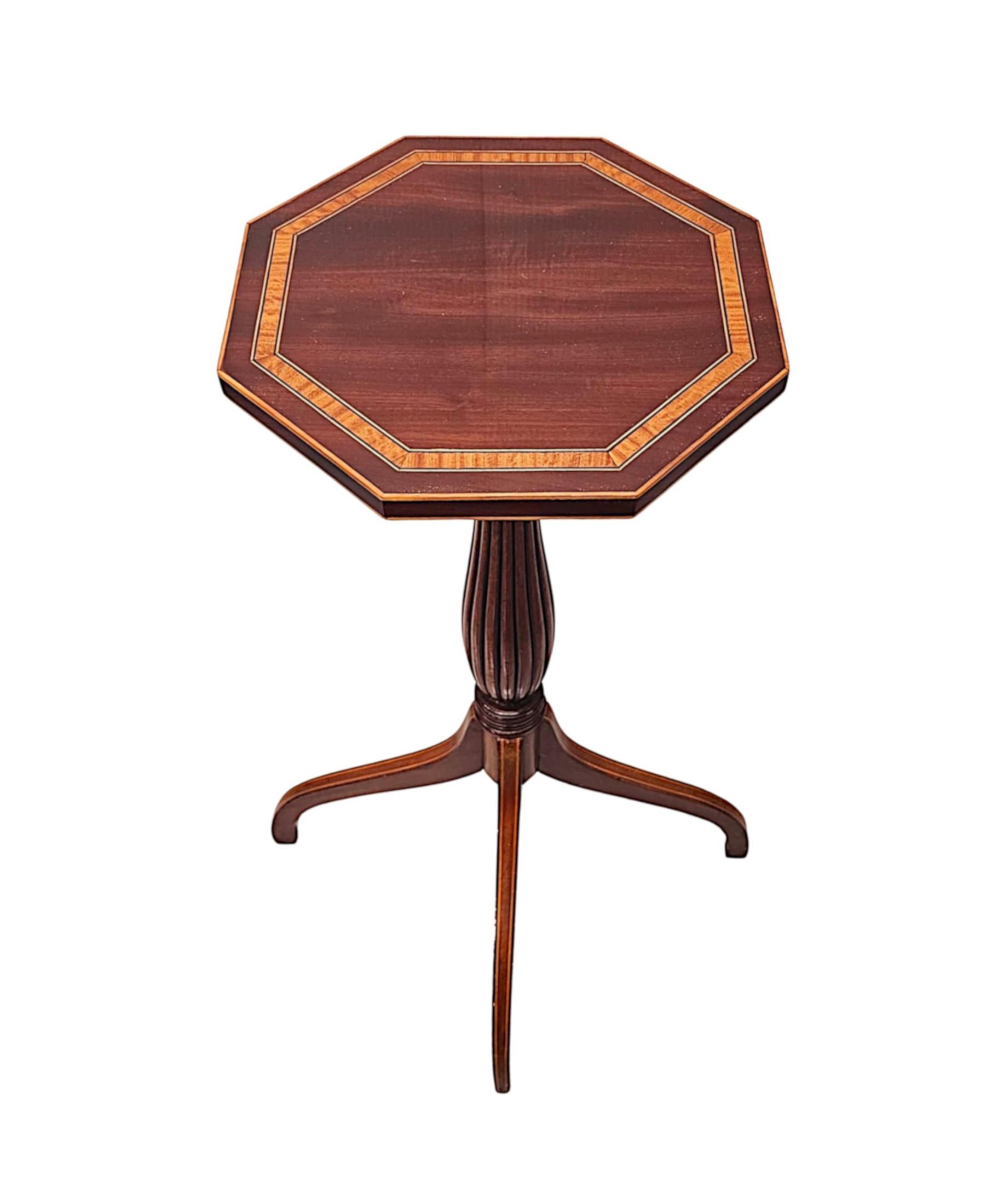 A very rare pair of Edwardian wine tables of tall proportions and fabulous quality.  This exceptional and finely carved pair with beautifully rich patination and grain feature gorgeous inlaid detail throughout.  The well figured moulded and