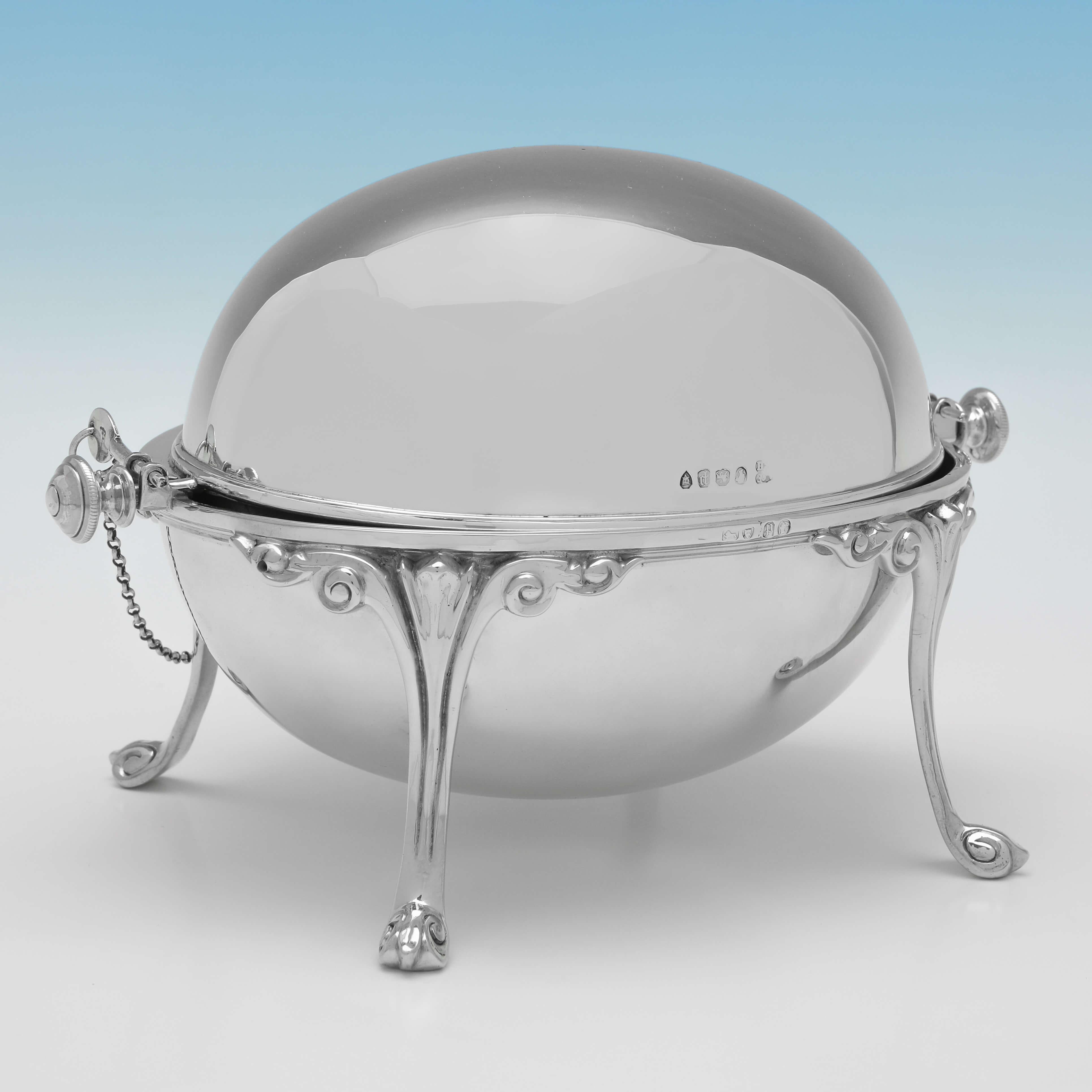 Hallmarked in London in 1870 by Frazer & Haws, this very handsome, Victorian, Antique Sterling Silver Revolving Butter Dish, stands on Neoclassical style legs. 

The butter dish measures 4.75